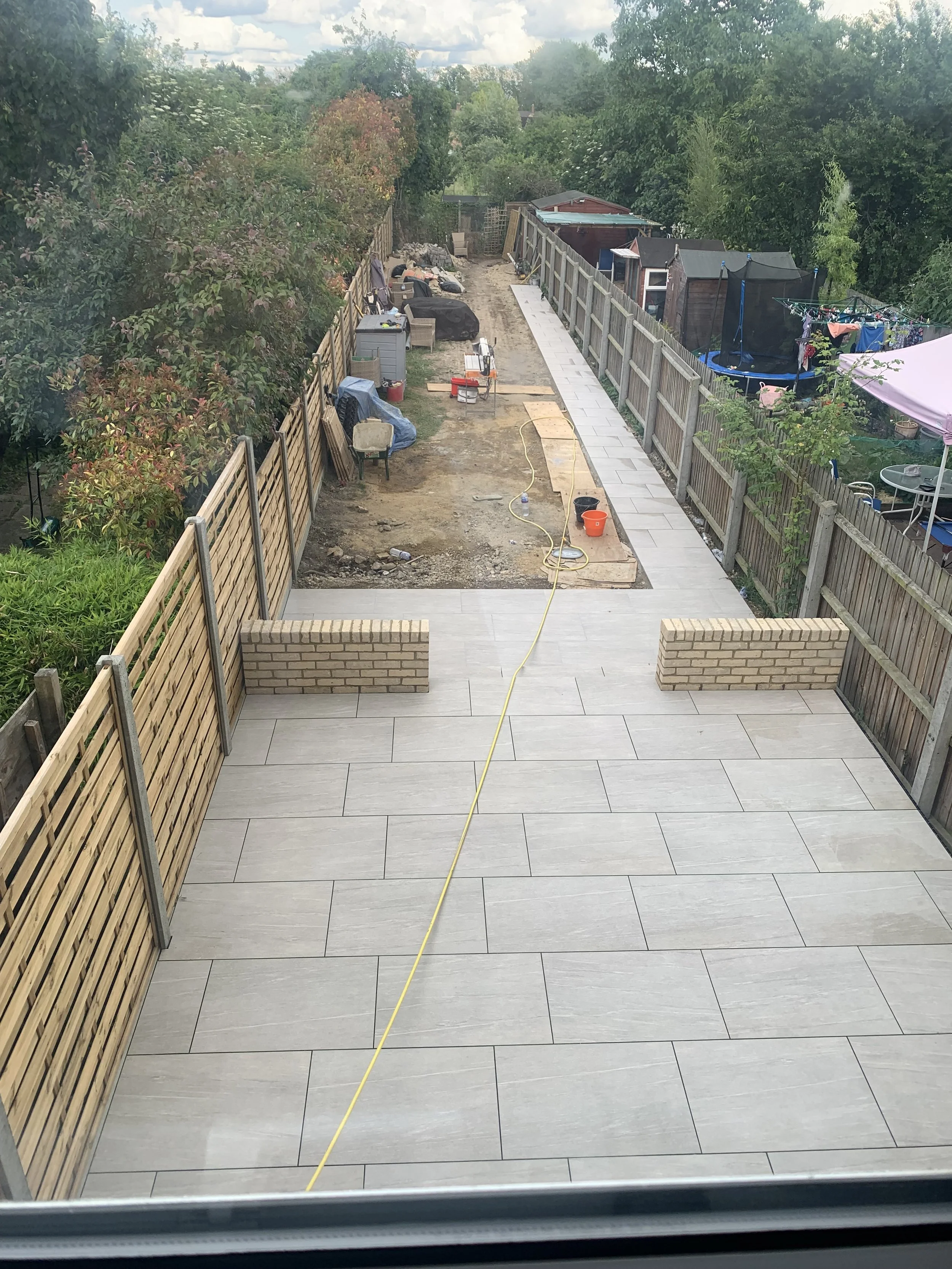 brickwork and porcelain paving to rear garden with new fences in cambridge