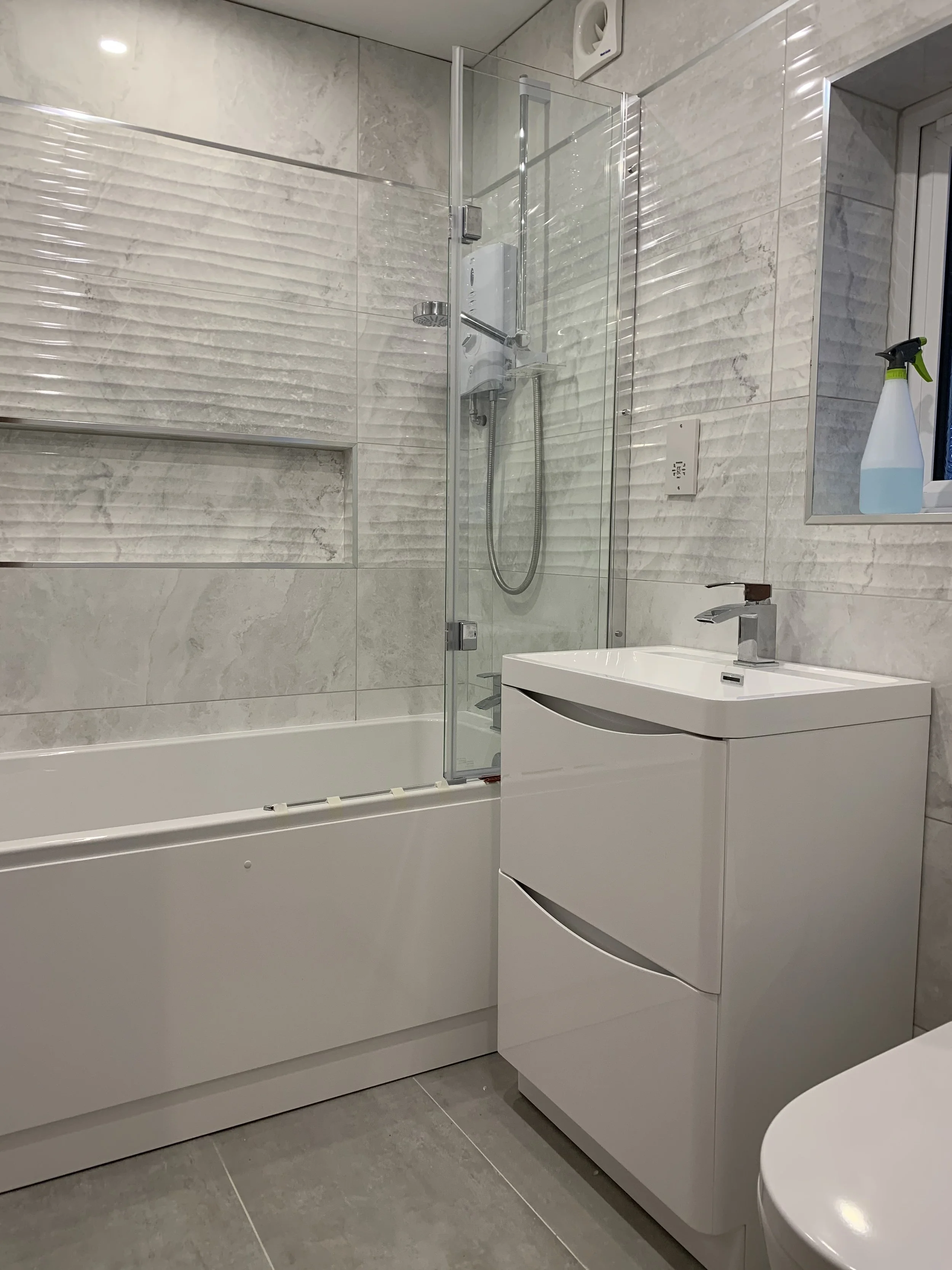 new bathroom installation with large format tiling in cambridge