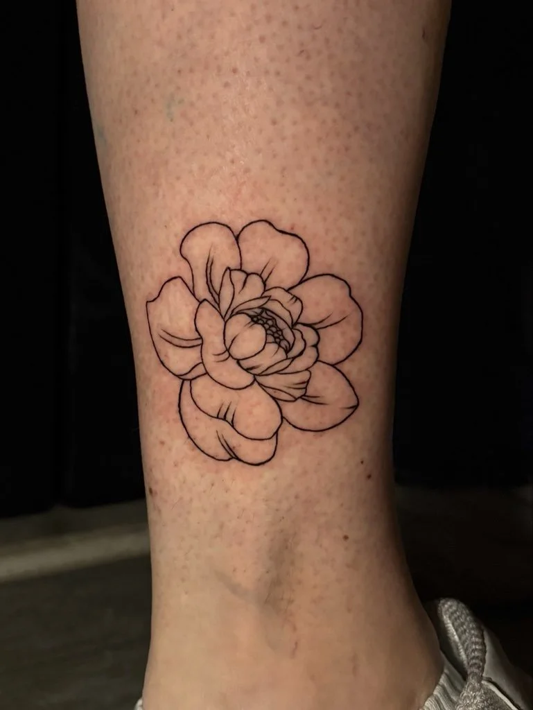 Fine line tattoo of a peony.