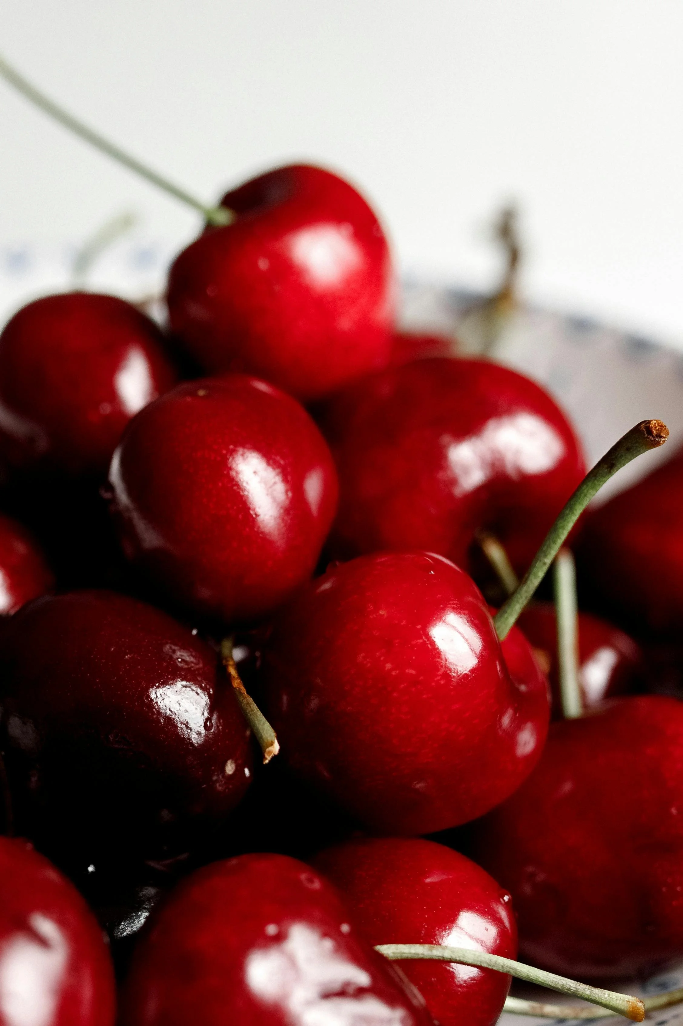 Close-up of fresh, shiny red cherries.