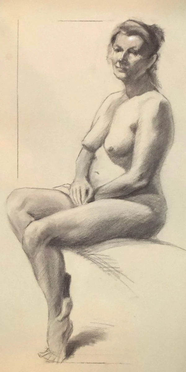A detailed charcoal sketch of a seated nude woman with short hair, sitting on a round surface with one leg crossed over the other, in profile view. Simon Broom