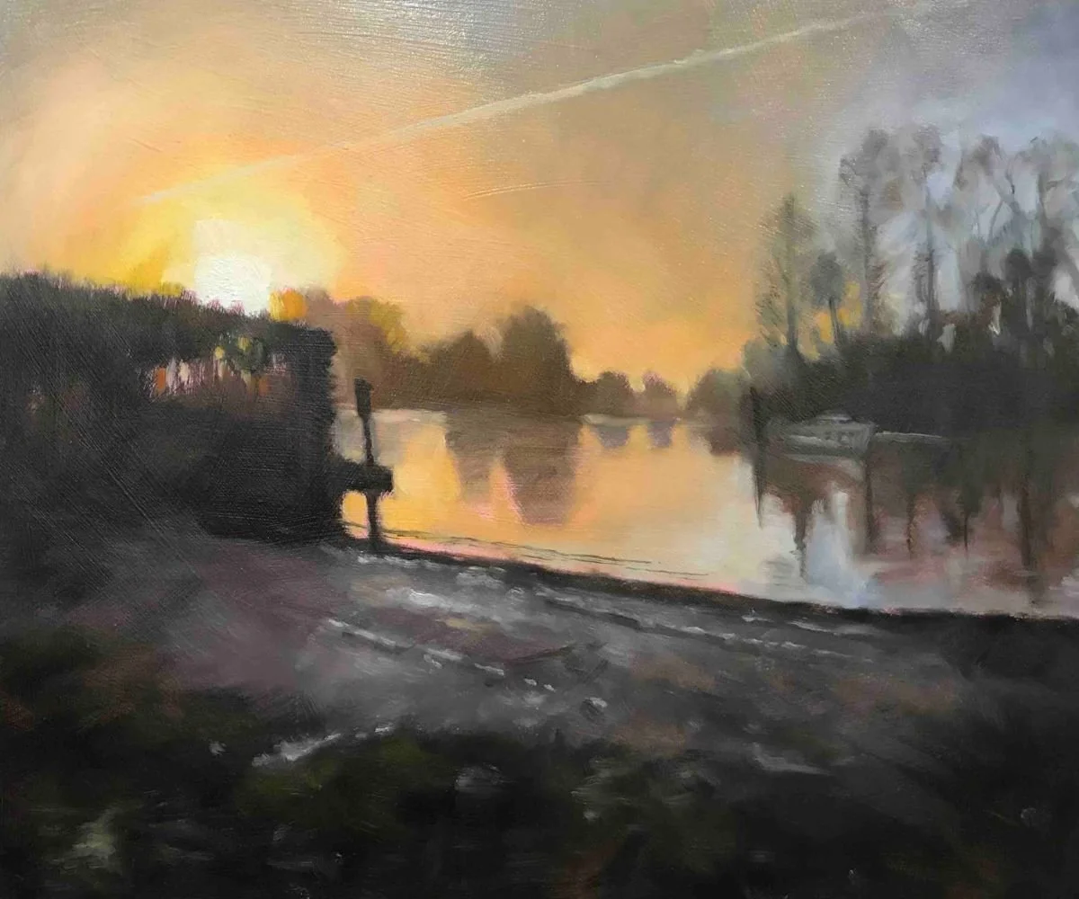 Painting of a sunset over a river with trees and boats, with a hazy, impressionistic style.