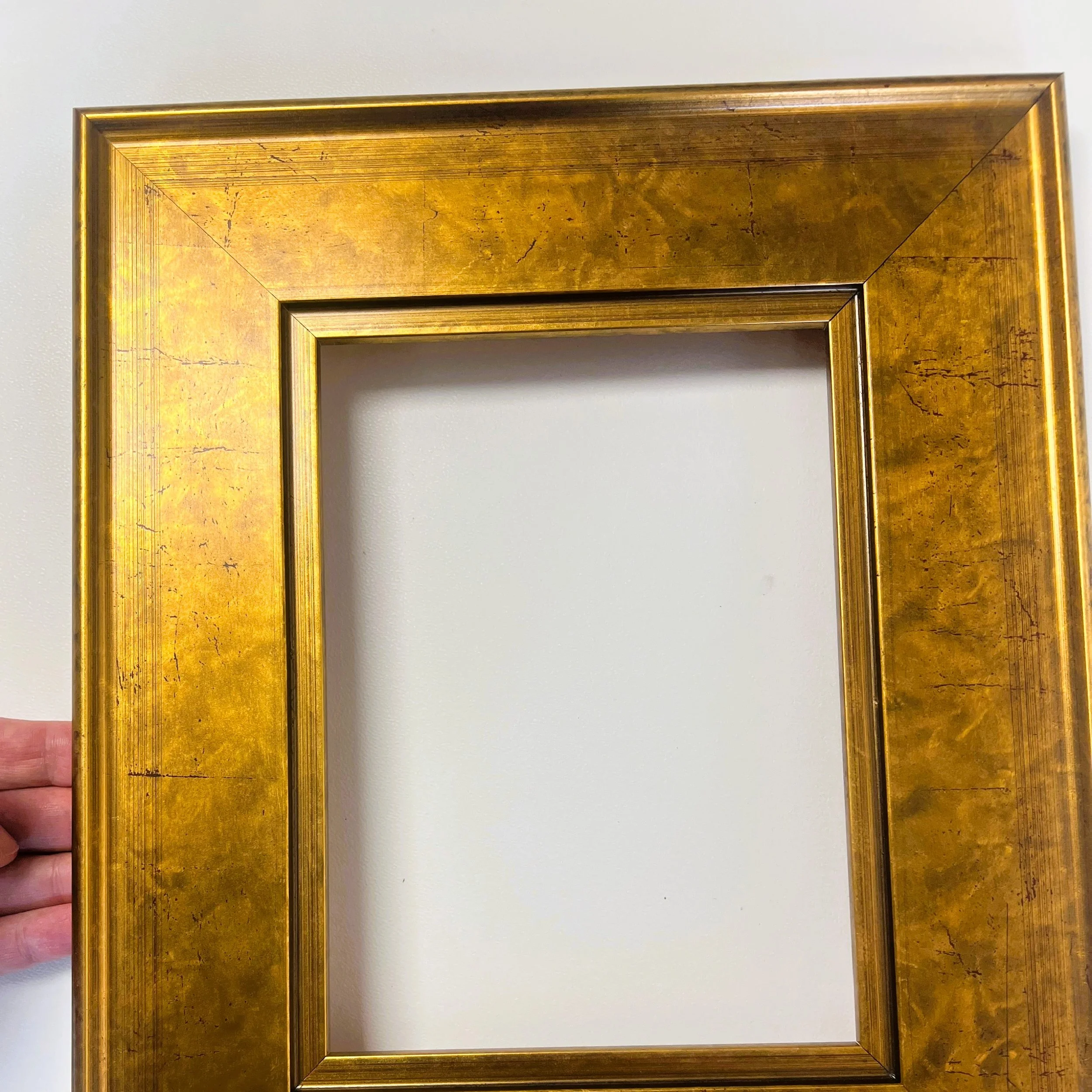 We have many beautiful gold frames.