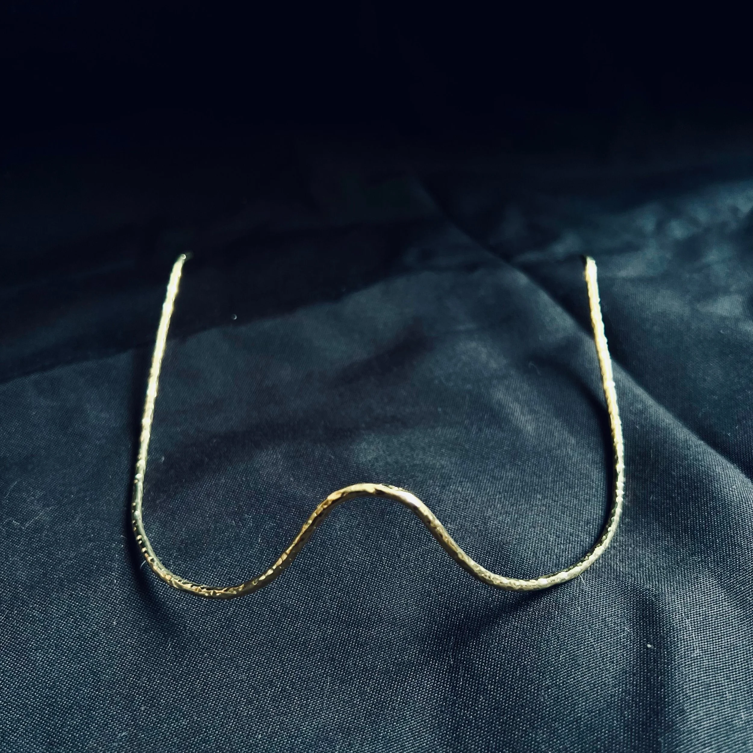 
Kinga Pua

Year: 2020
Artist: Theresia Kyalo
Medium: Jewellery
Dimensions: 15 cm across the face
Material: Brass/ Gold plate 
Edition : Limited Edition
Certificate: Accompanied by Certificate of Authenticity
Price: Available upon request