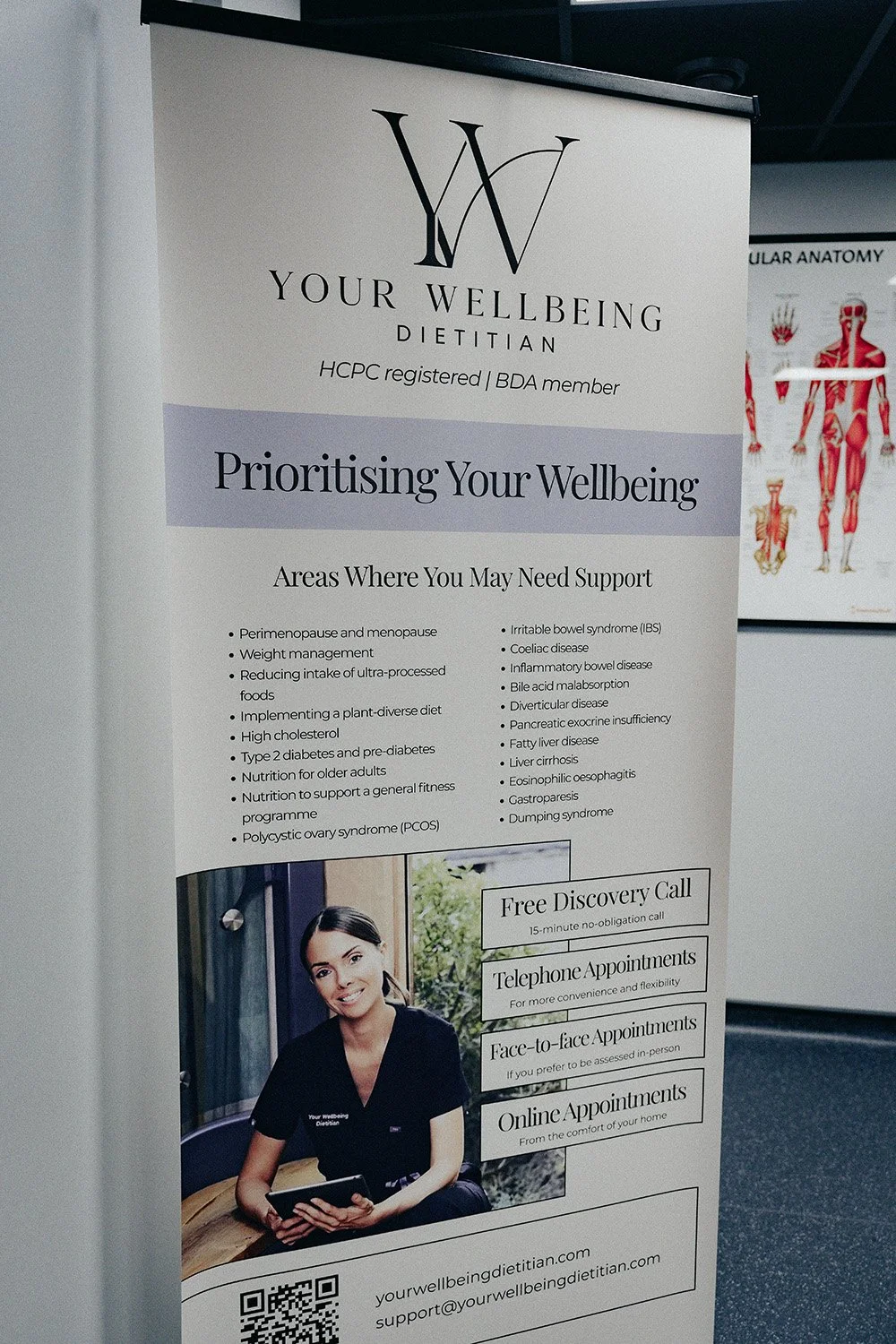 A sign advertising Your Wellbeing Dietition.