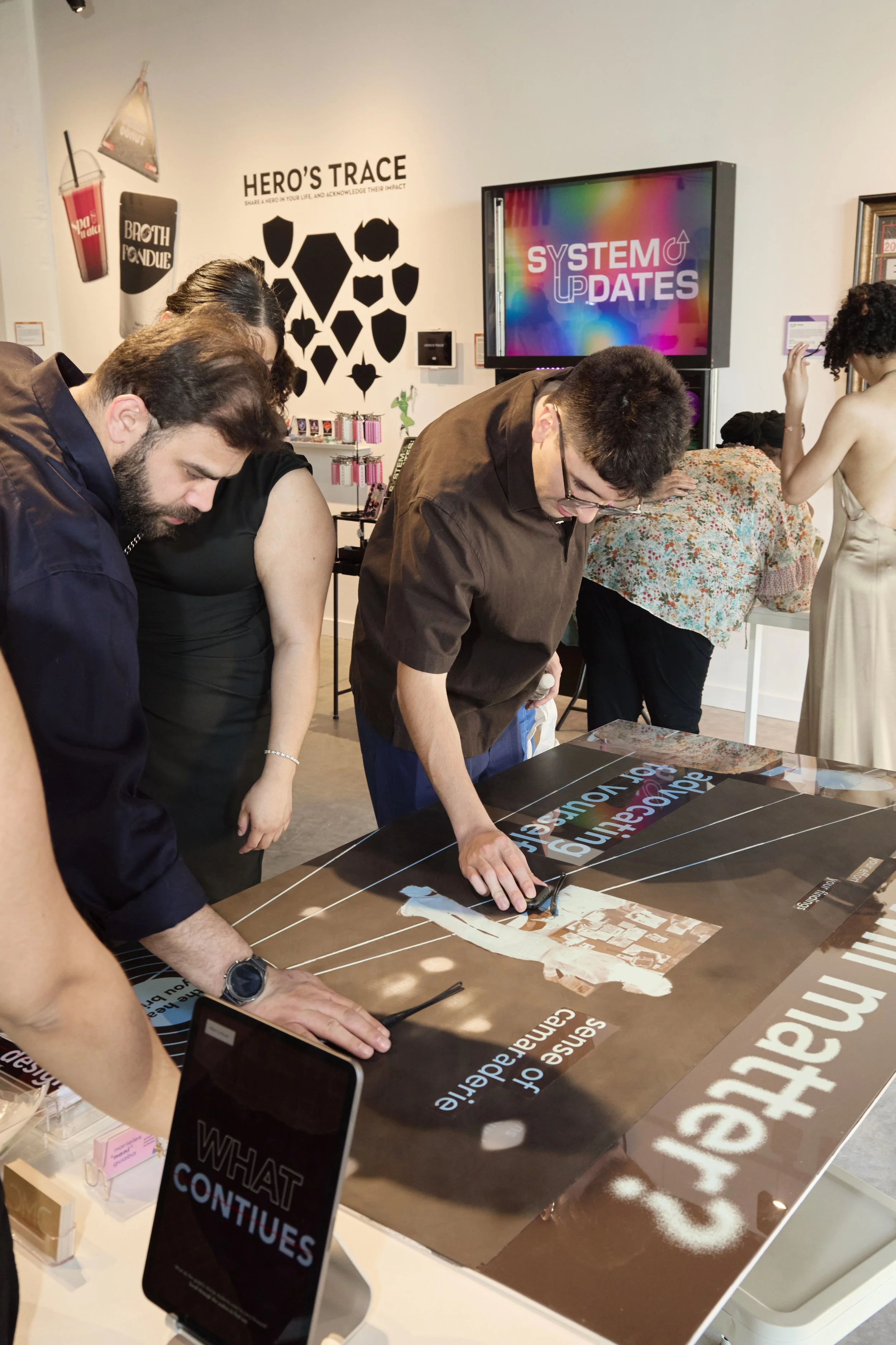 People interacting with the piece