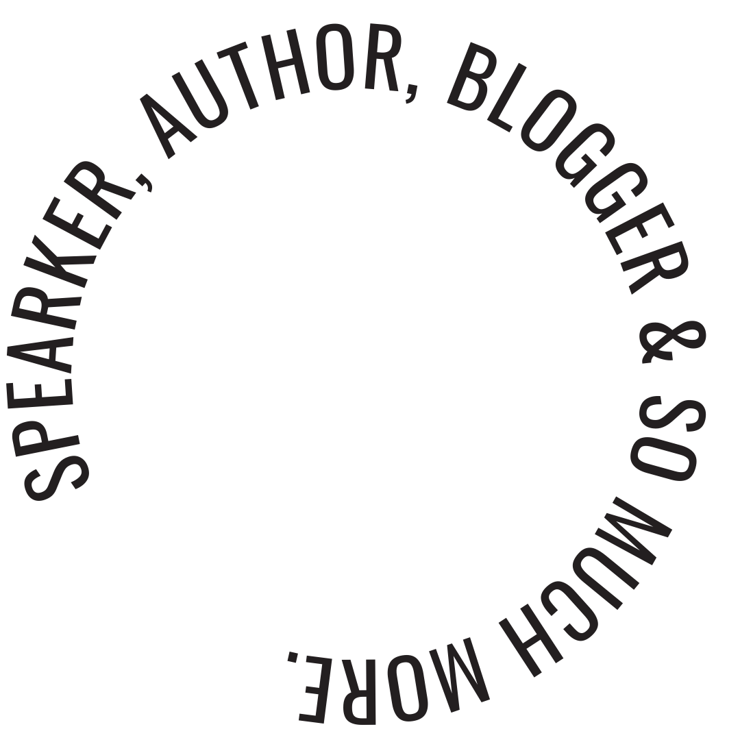 Black circular logo with the text 'Speaker, Blogger, & Mouth Mouche' around the edge.