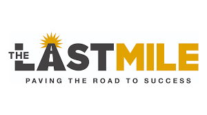 Logo for The Last Mile with the text 'Paving the Road to Success'.