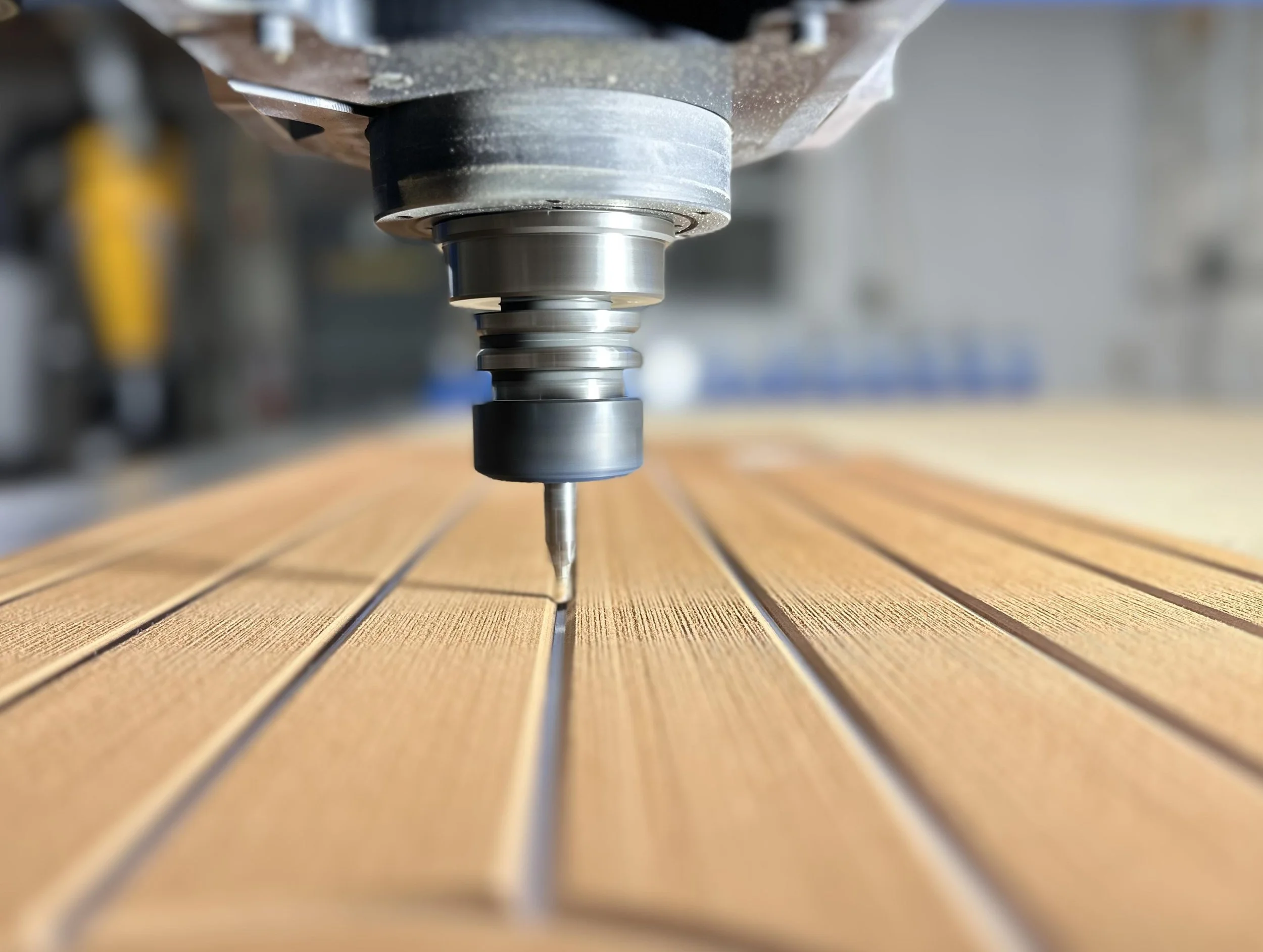 Close-up of a CNC machine carving EVA/PE foam decking.
