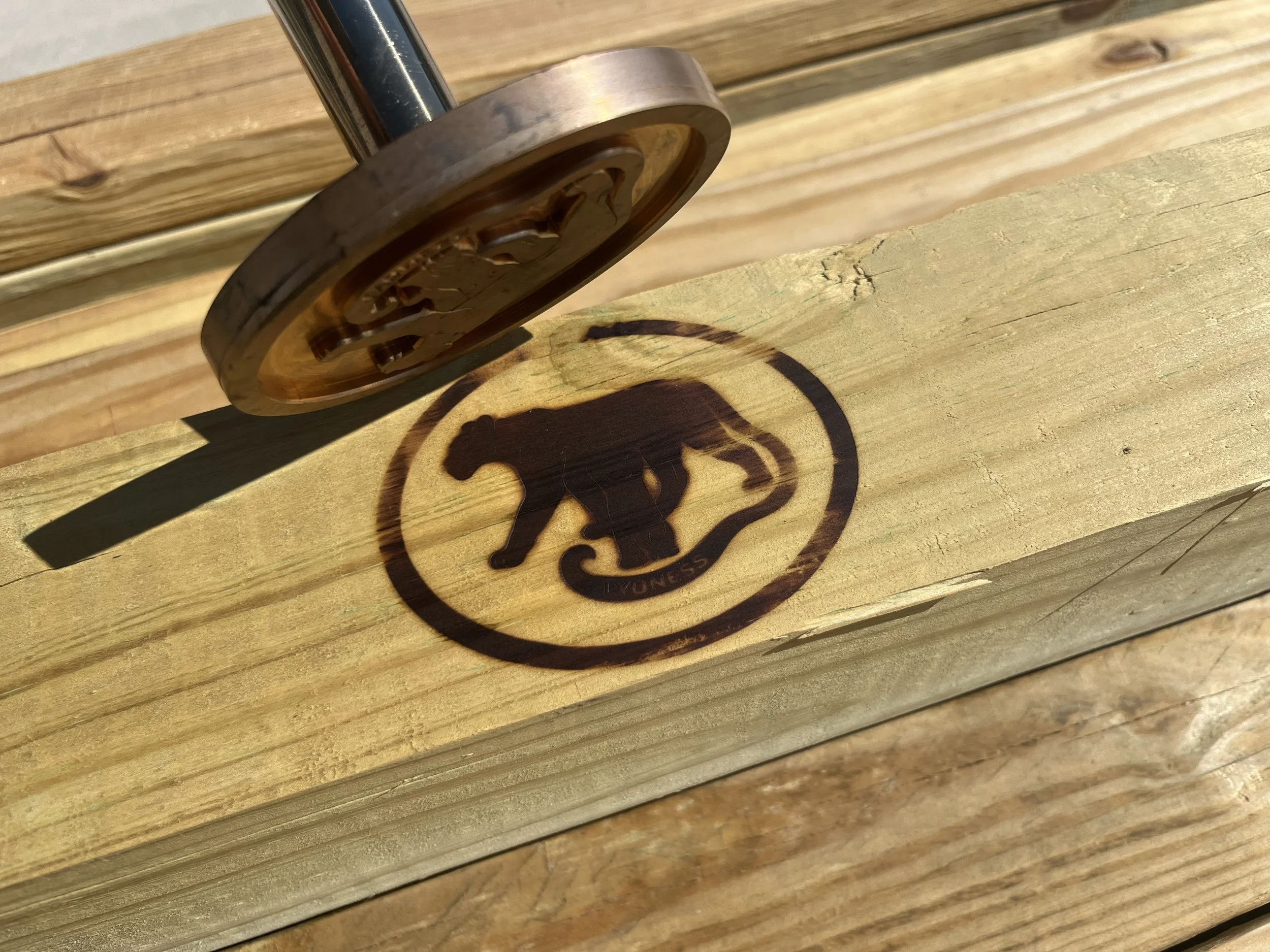 Lyoness industries logo on an outdoor pergola kit. suspended day bed kit, all-inclusive kit