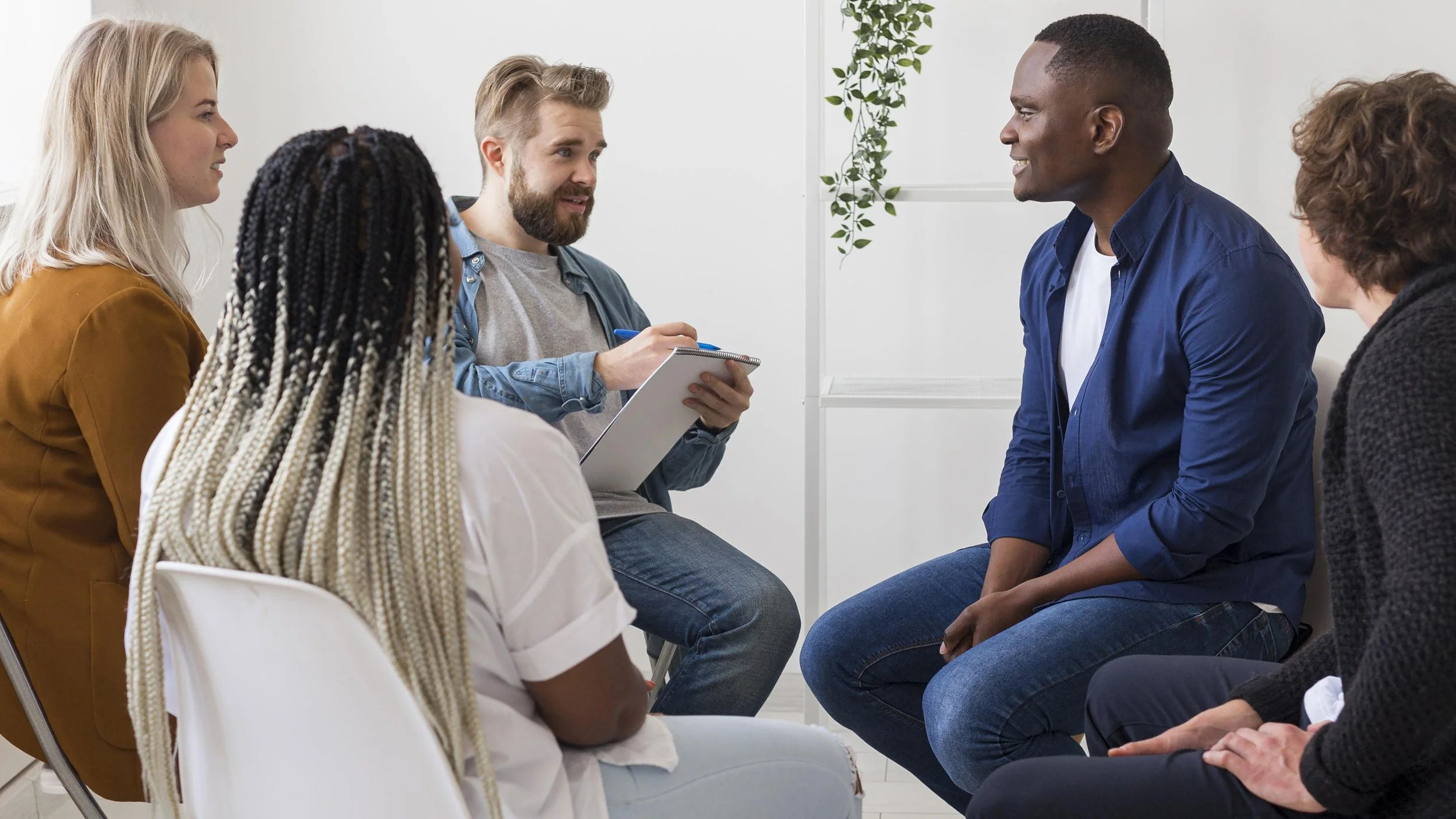 Comfortable counseling office with calming blue tones designed for in-person therapy sessions