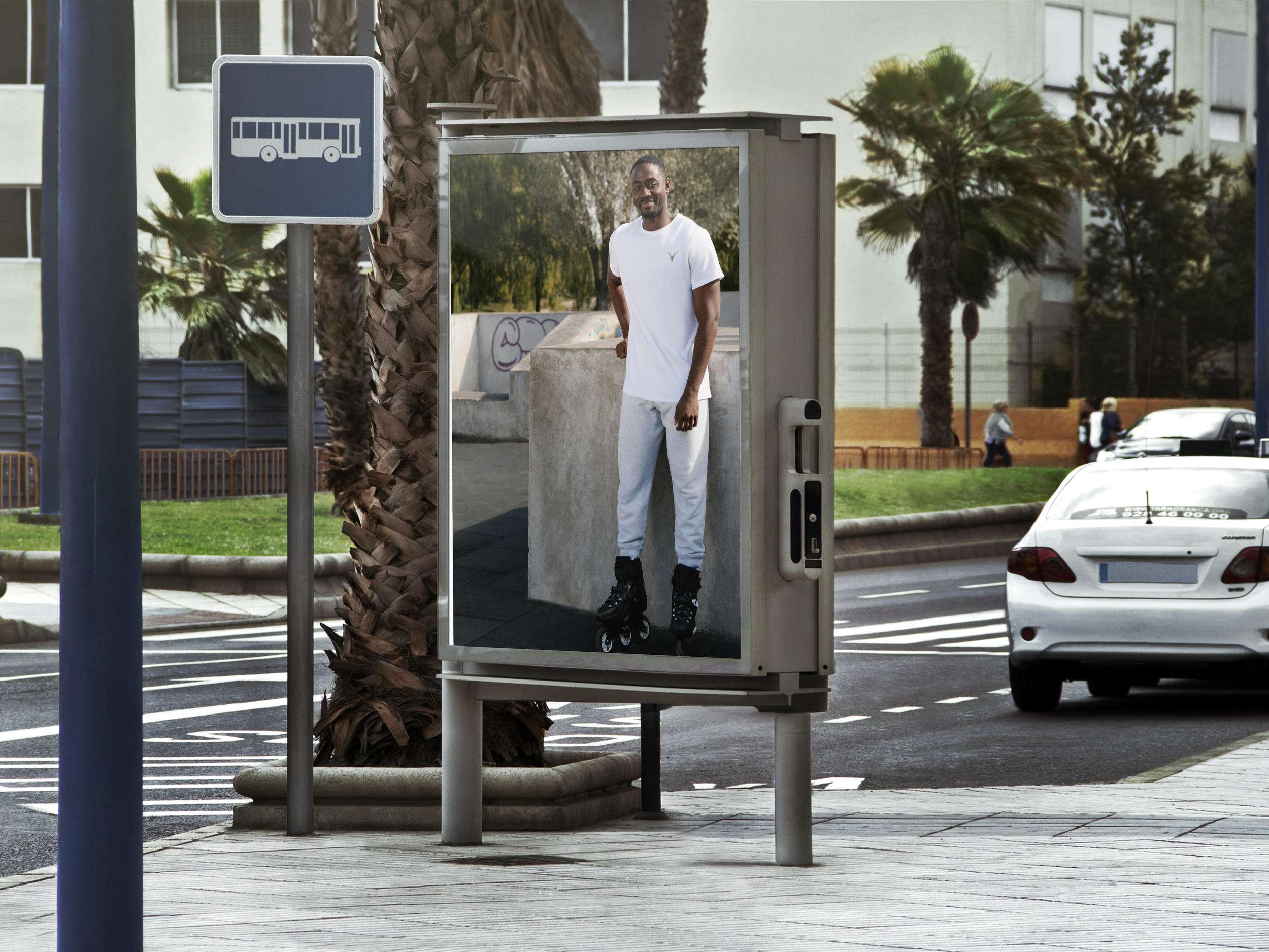 Street ad of a roller skating man wearing white "TheMate" from stYle Collections by YXELON.