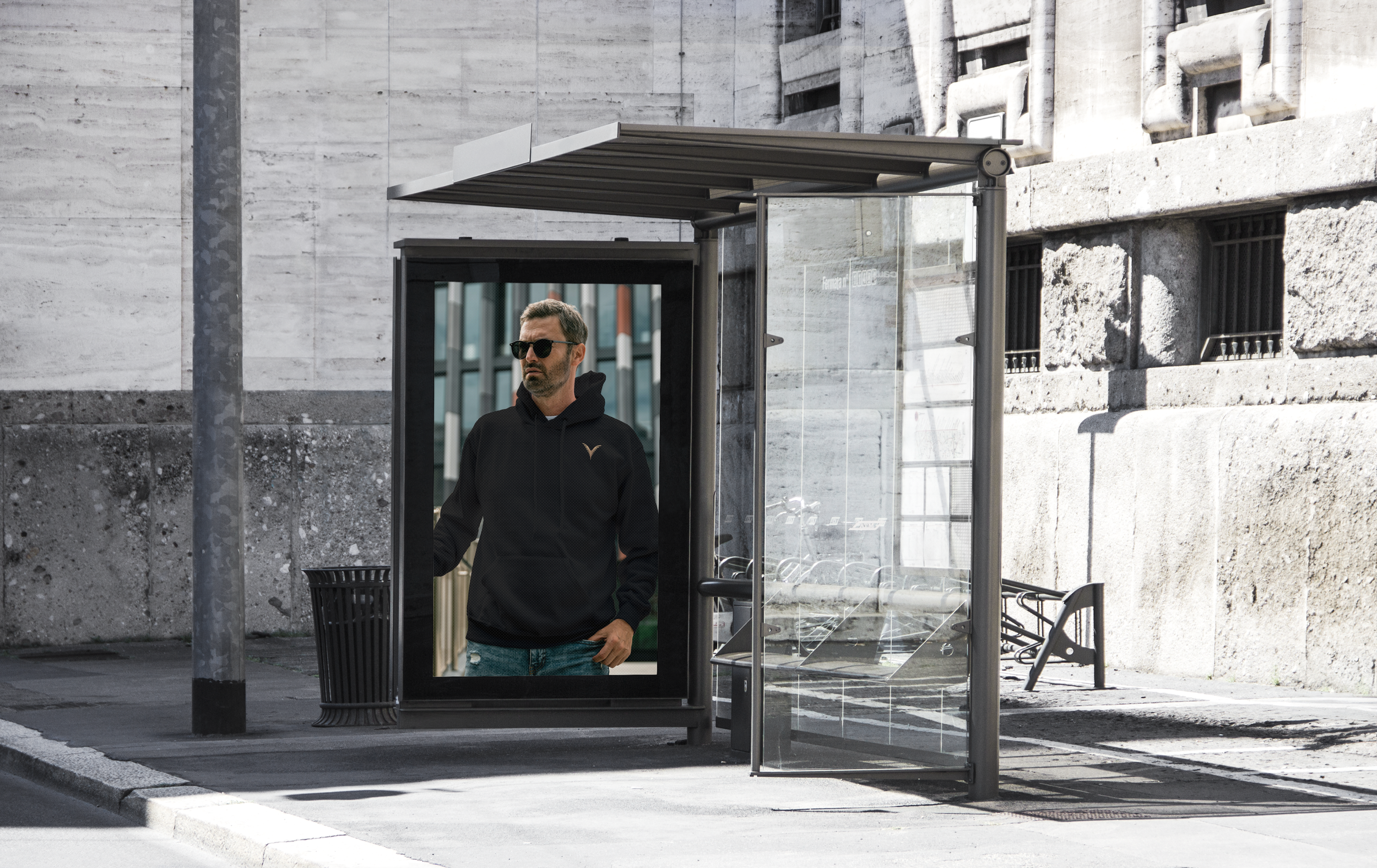 Bus Stop ad of a man wearing a black "HoodiSquad" from stYle Collections by YXELON.