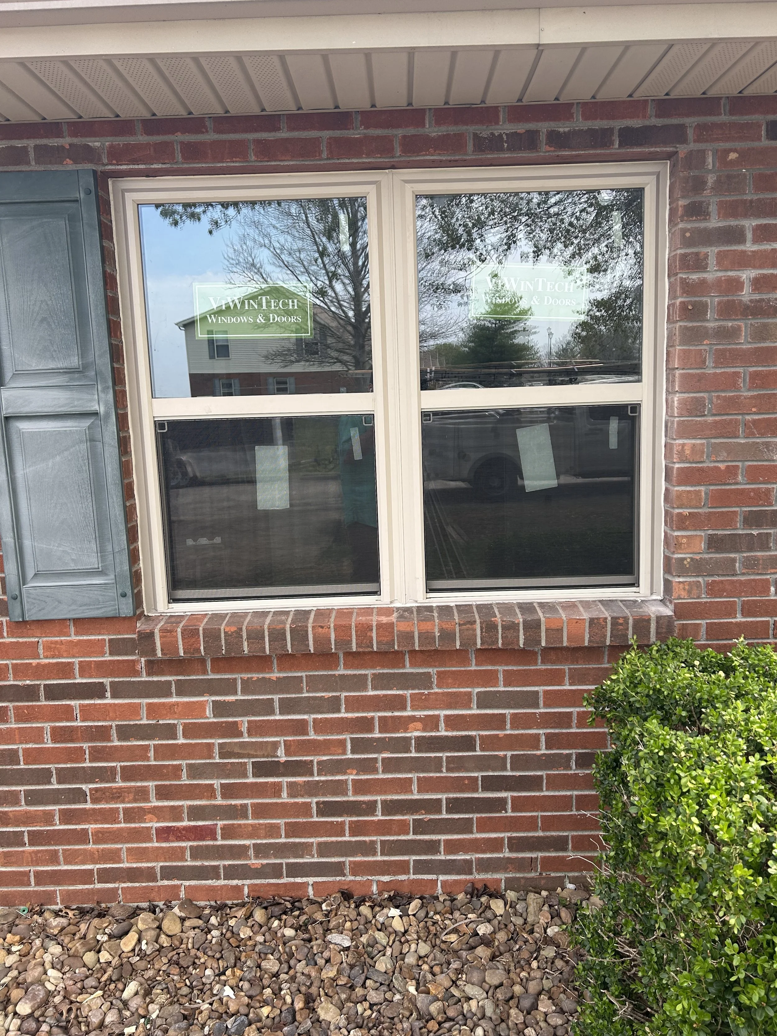 New double hung replacement windows installed by Lil Fellers LLC on a brick home in Clarksville, TN.