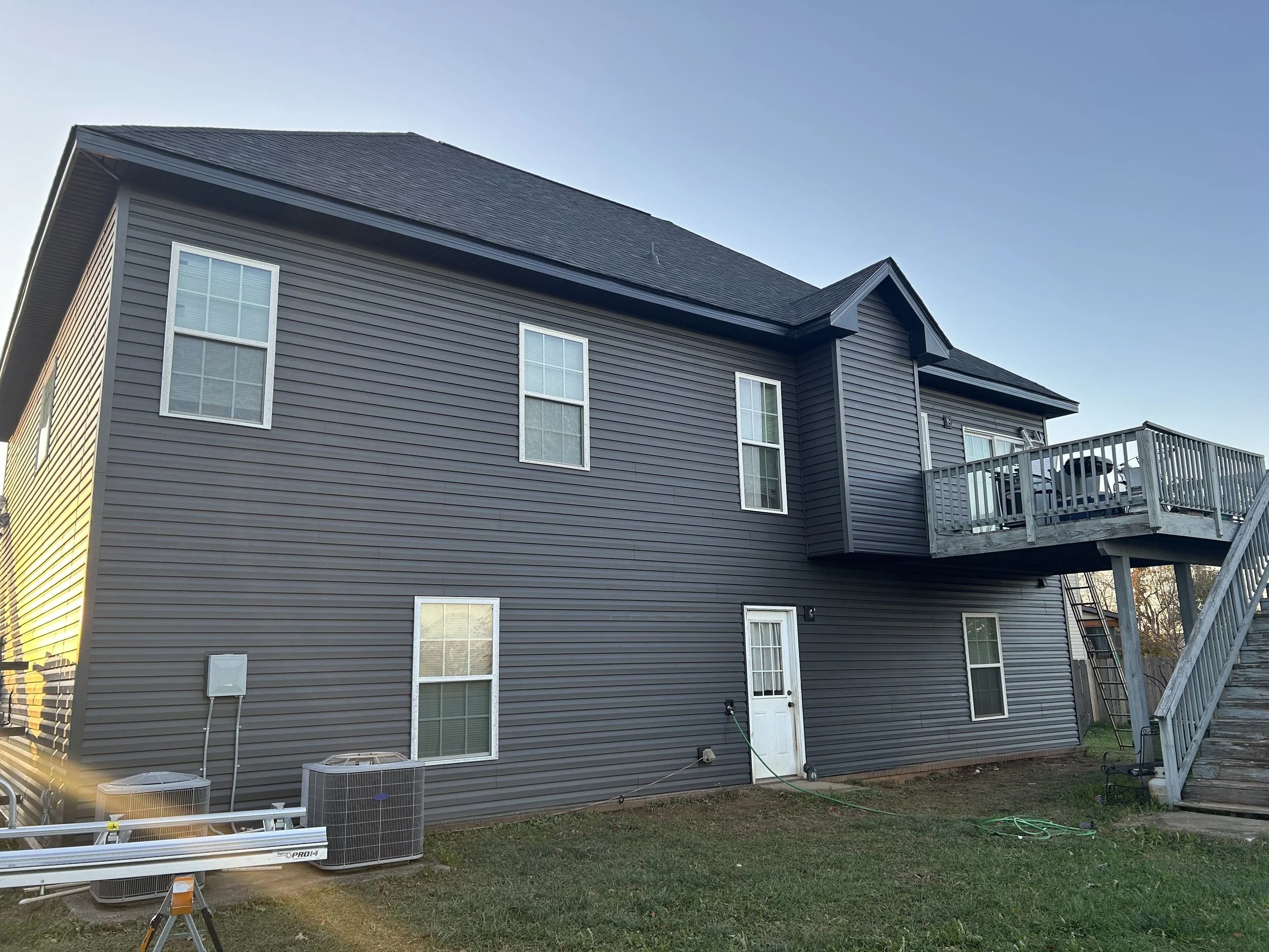 Completed vinyl siding installation on a two story home in Clarksville, TN by Lil Fellers LLC, veteran owned siding contractor.