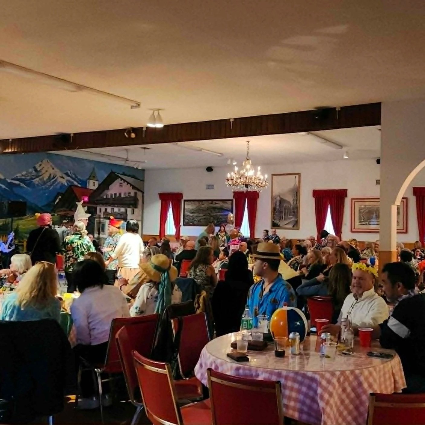 the audience at a restaurant watching a performance by the Volcano Band