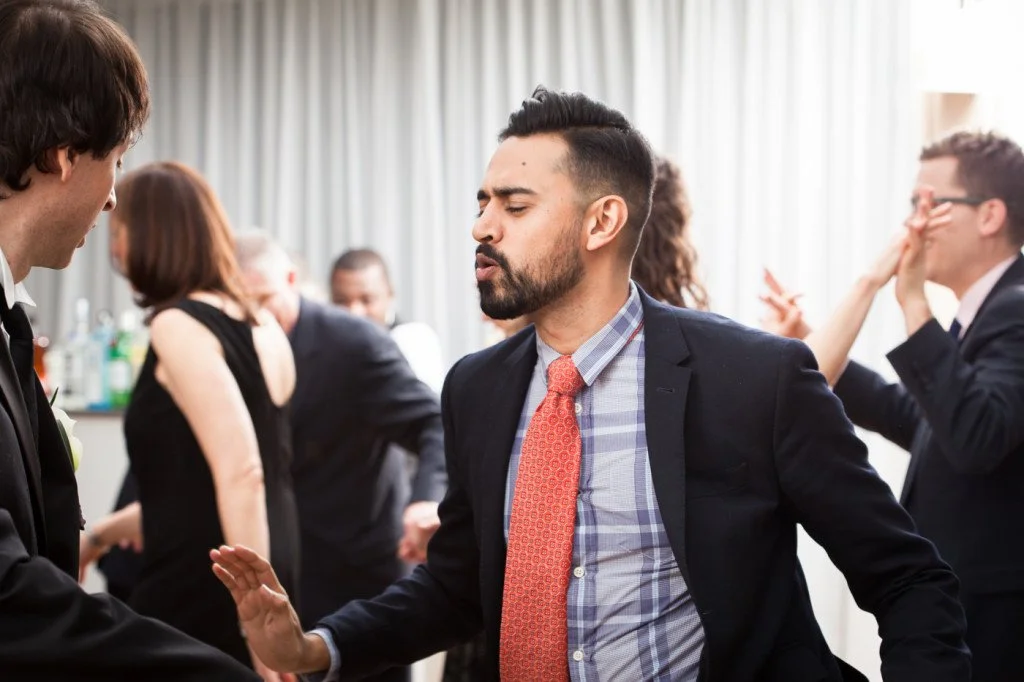 People at a social event or party, dancing and socializing.