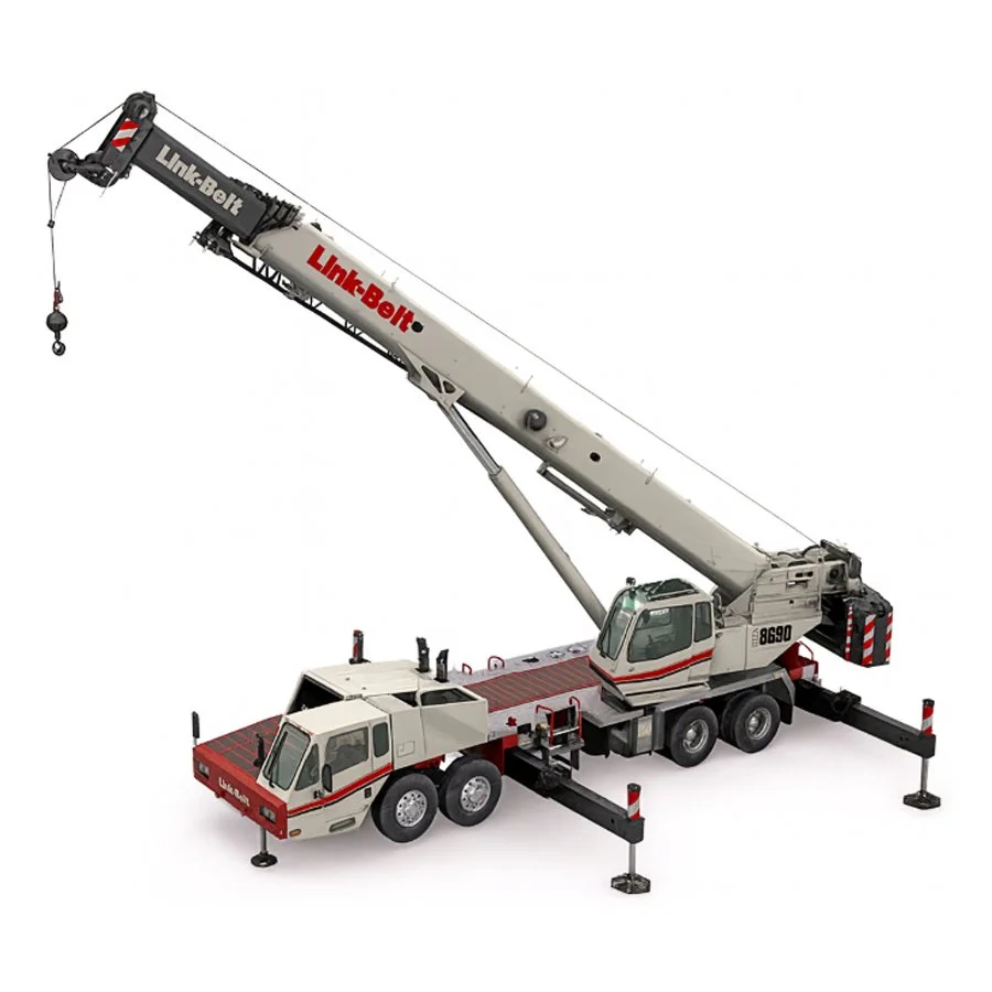 A construction crane lifting a large wooden house structure above a residential neighborhood with a clear blue sky.