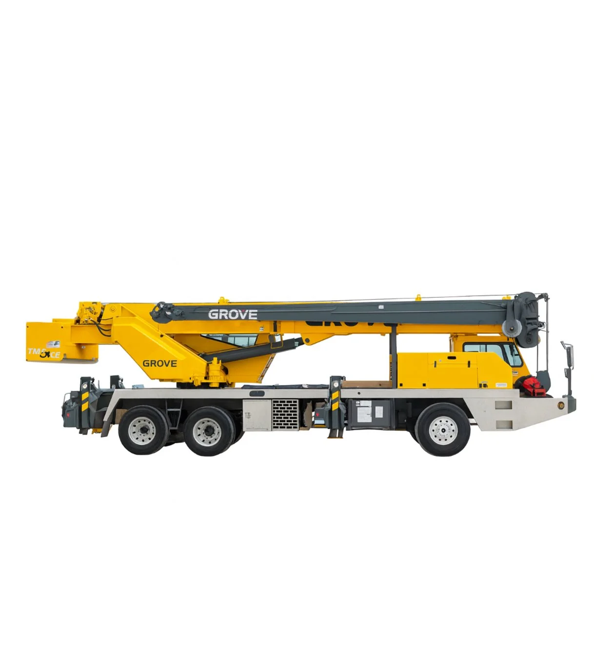 A yellow Grove boom truck with a black crane arm, black and yellow striped safety markings, and multiple tires.