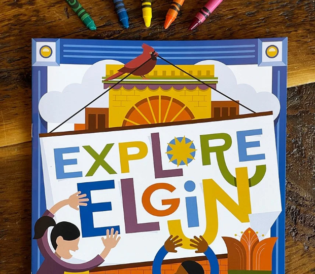 Children pointing at a colorful poster that says "Explore & E L U N" with a sunrise, cityscape, and a bird on a tree branch, surrounded by crayons.