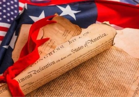 Declaration of Independence on tope of an America Flag