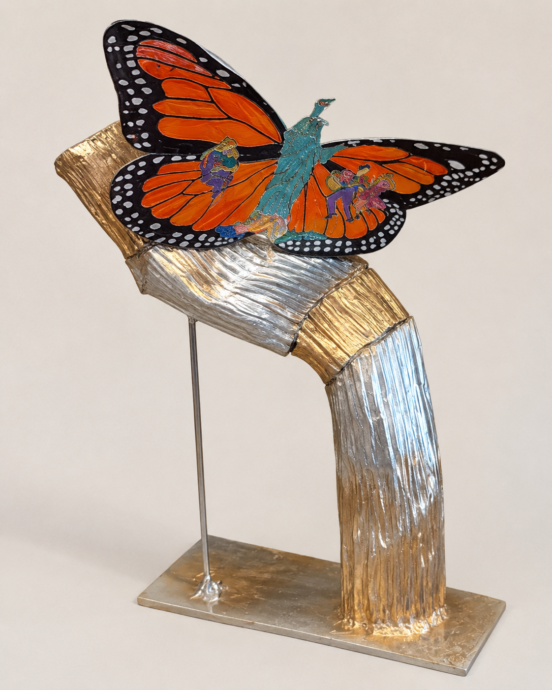 Colorful butterfly sculpture created for Elgin’s America 250 Public Art Project, featuring a monarch butterfly with symbols of unity, diversity, and hope mounted on a handcrafted metallic base.