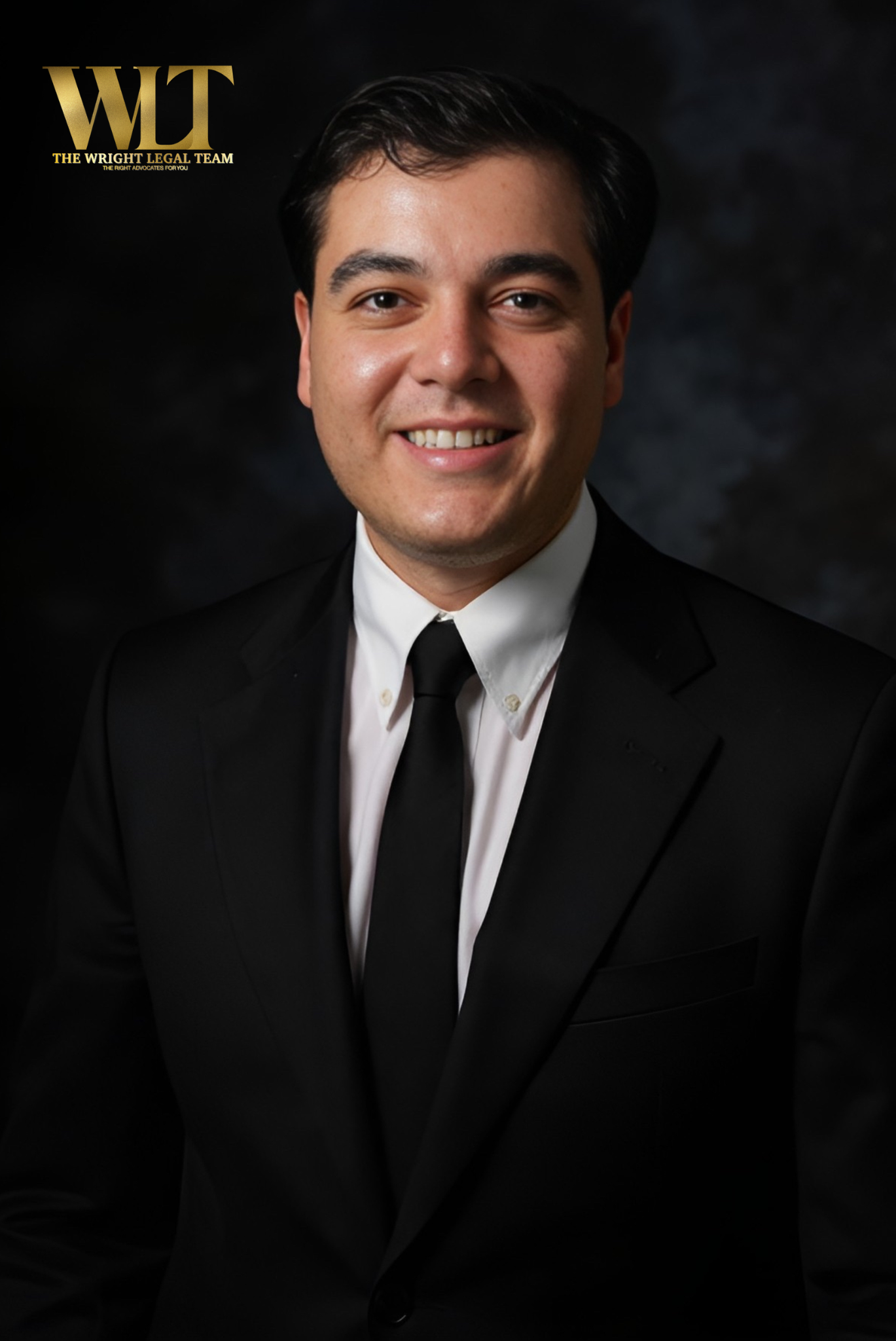 Professional headshot of a man in a black suit, white dress shirt, and black tie, smiling against a dark background with the logo 'WT' and the text 'The Wight Legal Team' in the top left corner.