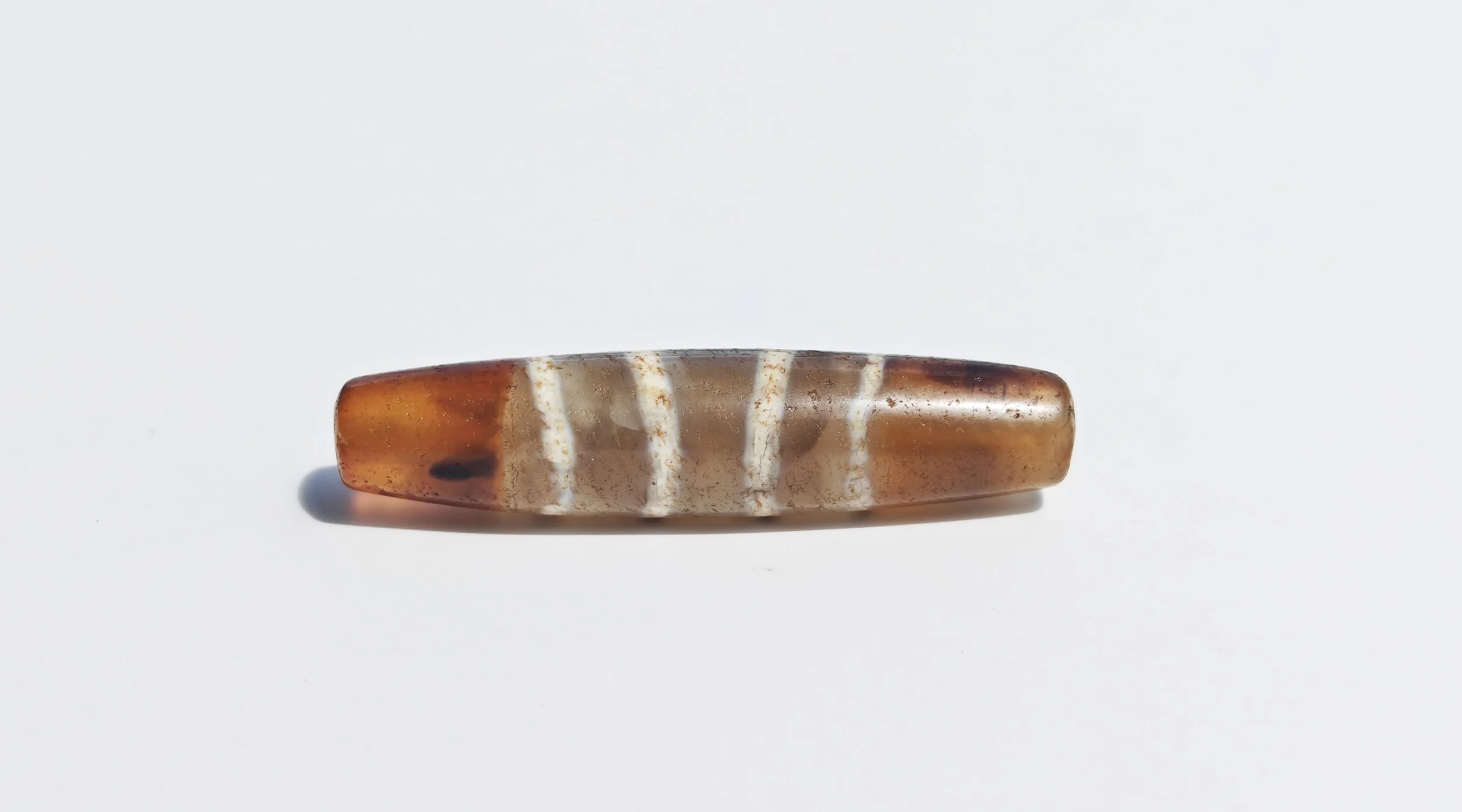 A Tibetan Agate Striped 'Chung' Dzi Bead – Himalayan Region