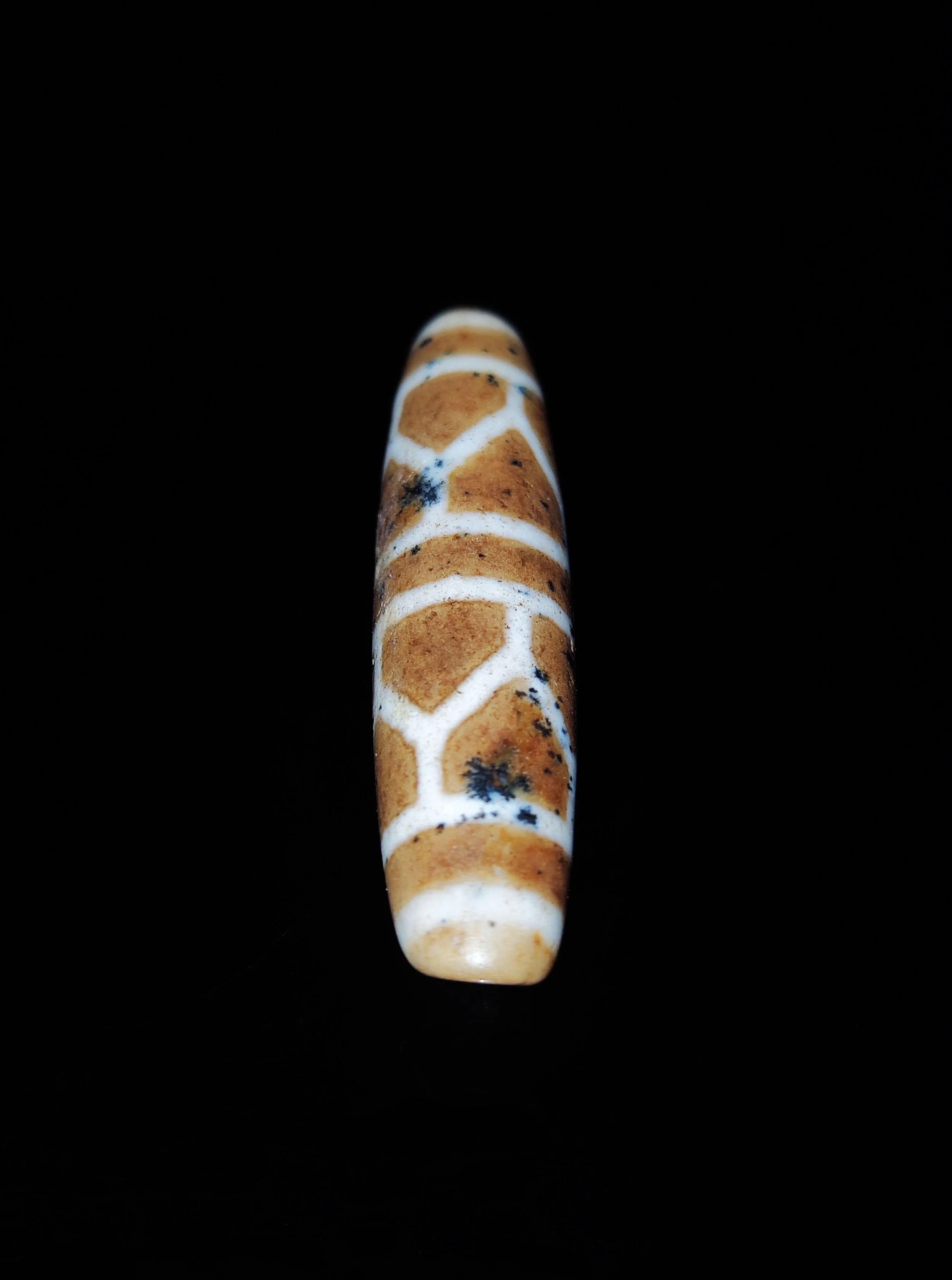 A Tibetan Agate ‘Tortoise Shell’ Dzi Bead