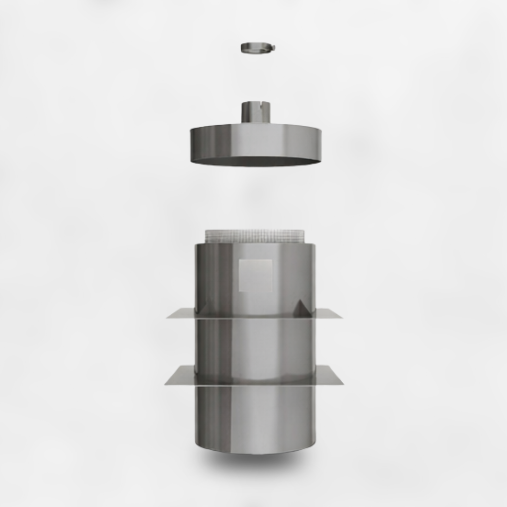Disassembled metallic capsule or container components suspended in mid-air against a white background.
