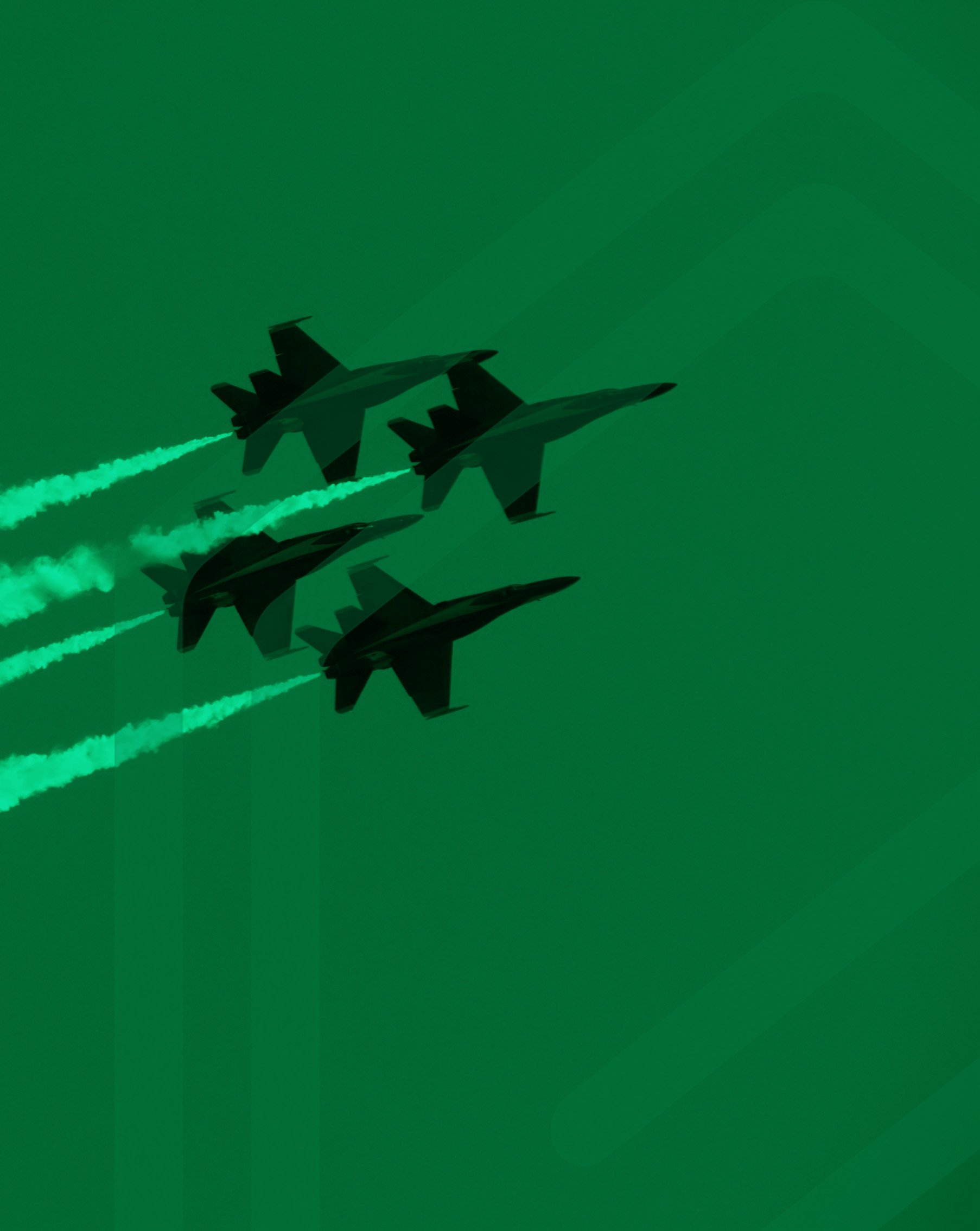 Two fighter jets flying in formation, leaving green contrails behind them against a green sky.