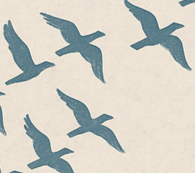 The closeup silhouettes of several birds, flying. The birds are shown in deep deal and the sky is cream.