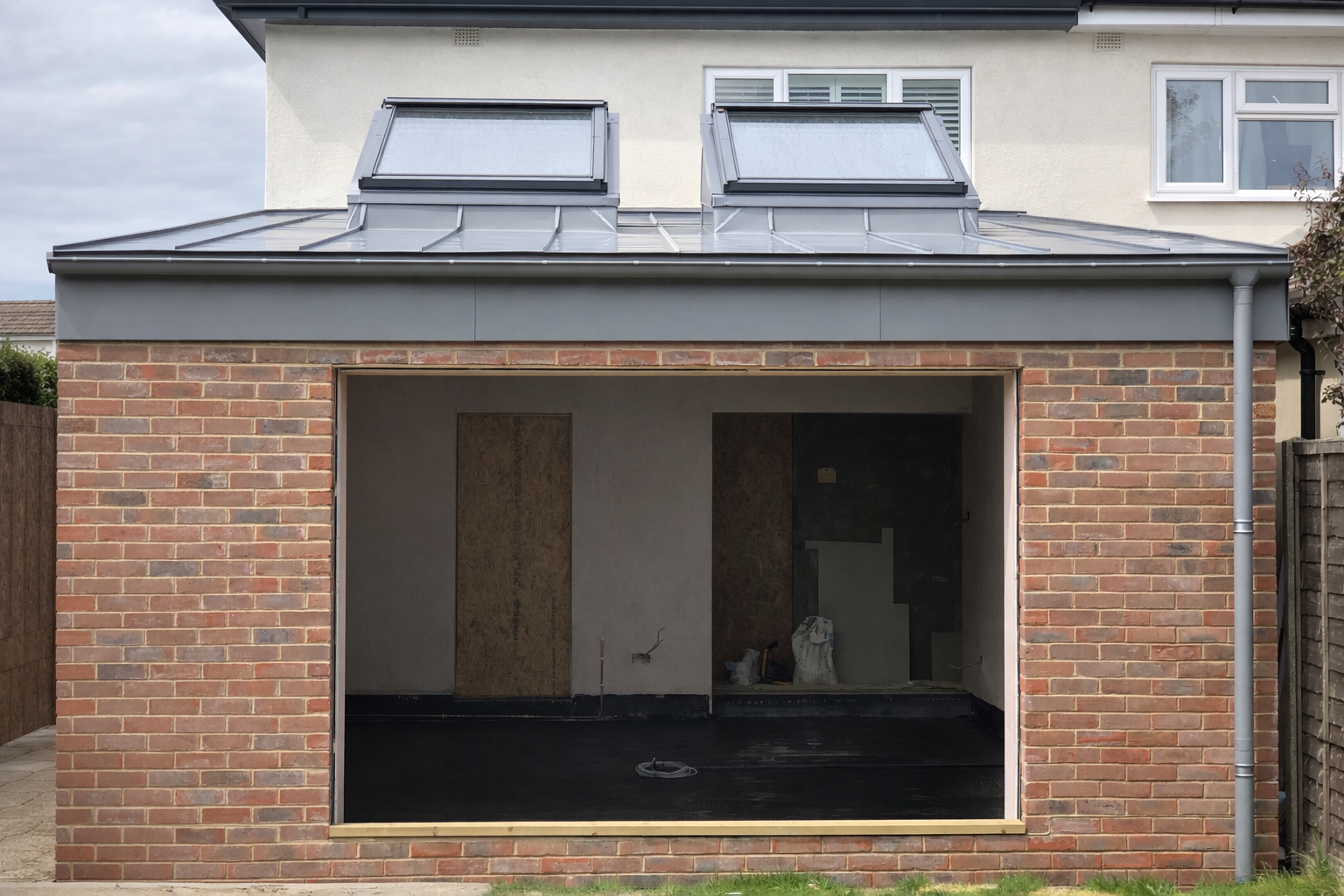 Modern garage extension with flat roof.png