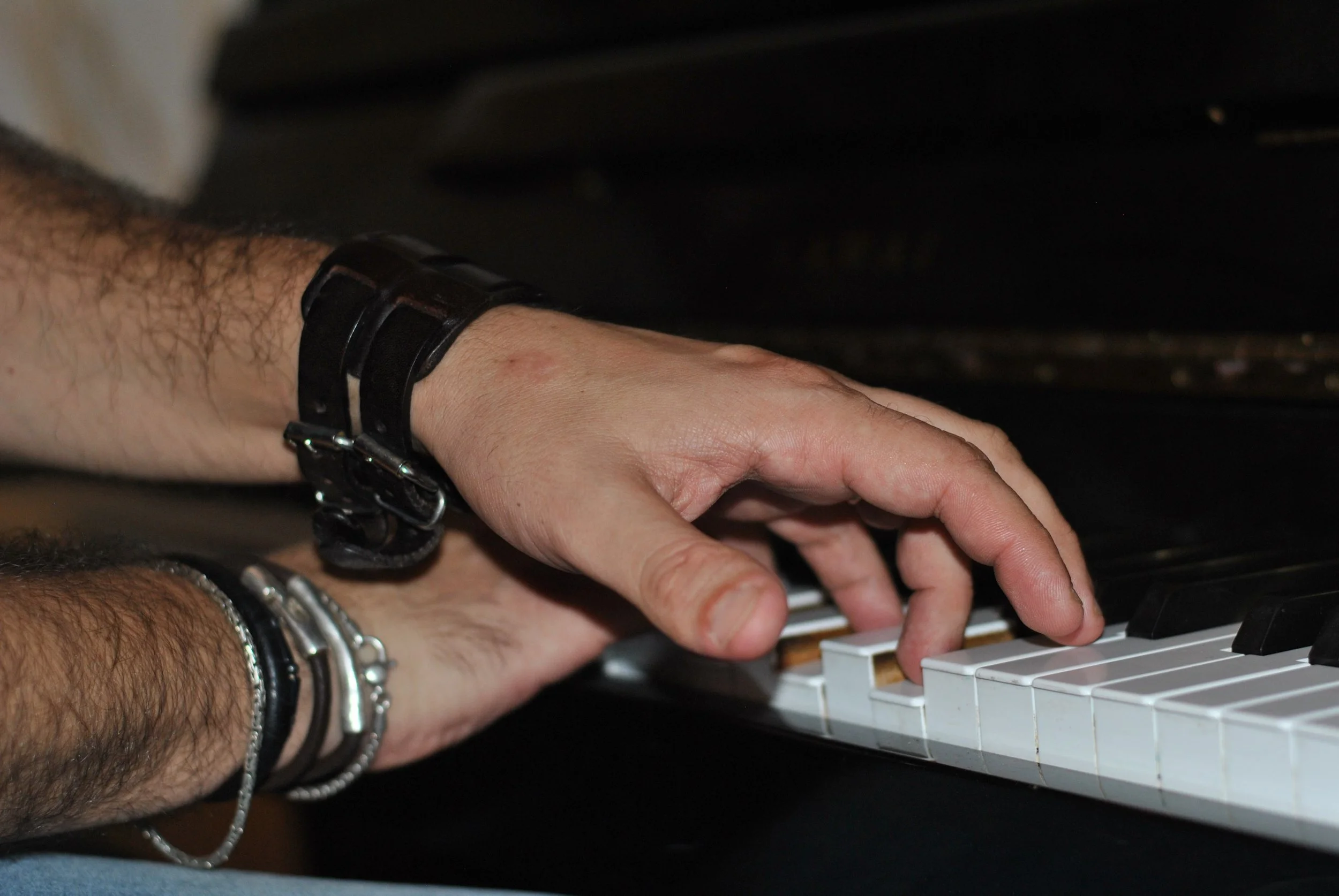 man & piano keyboard