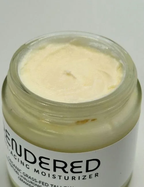 Open jar of Rendered Anti Aging face moisturizer with cream visible inside.