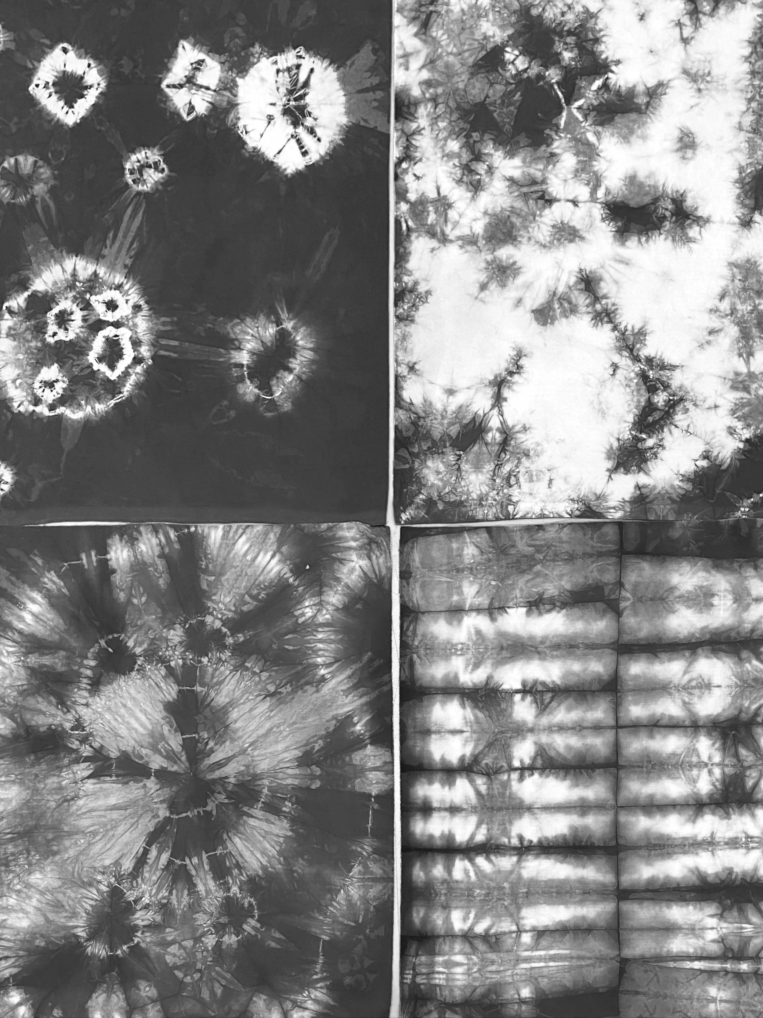 A collage of four different black and white tie-dye fabric patterns featuring various abstract and floral designs.