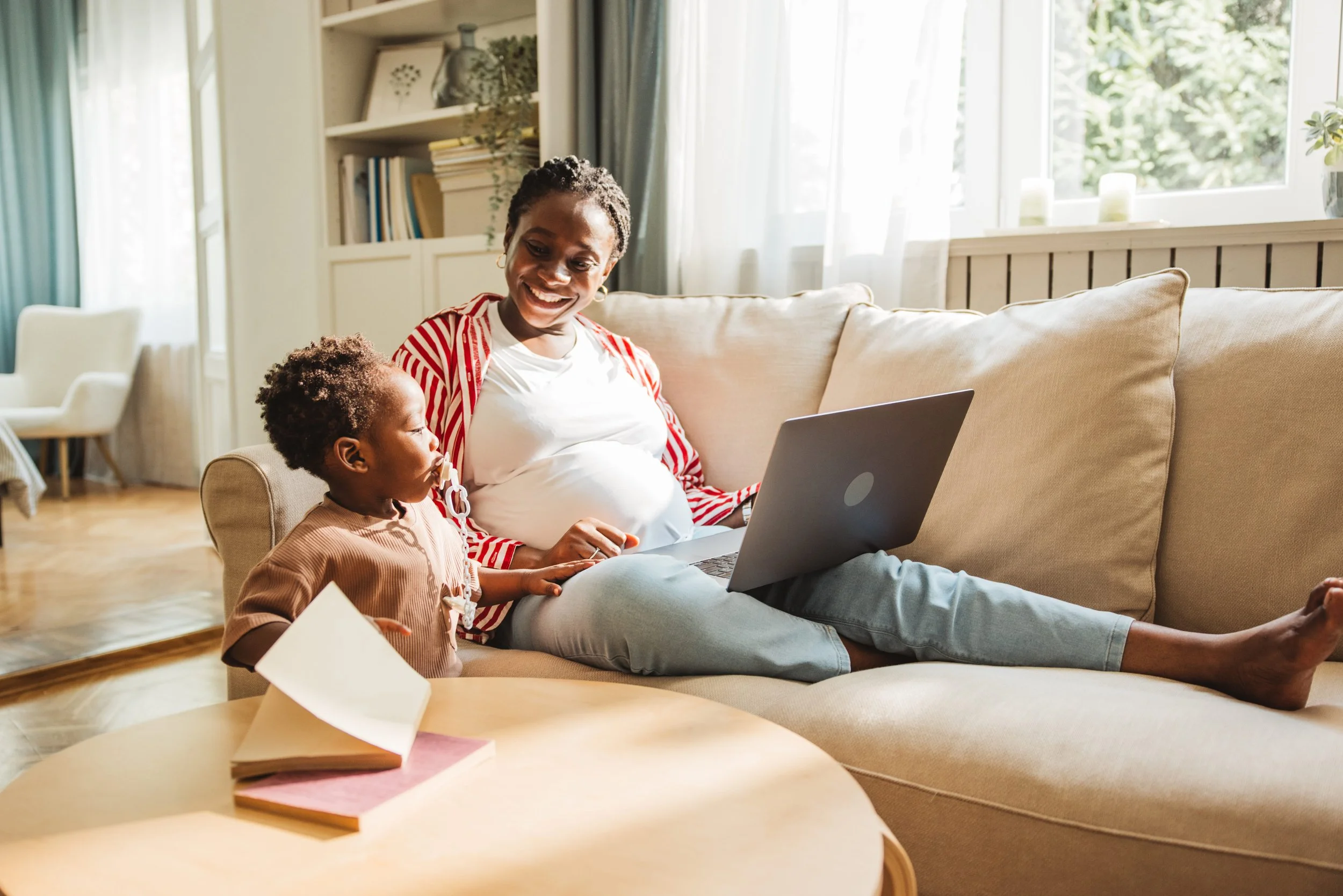 pregnant mother and child on a video call