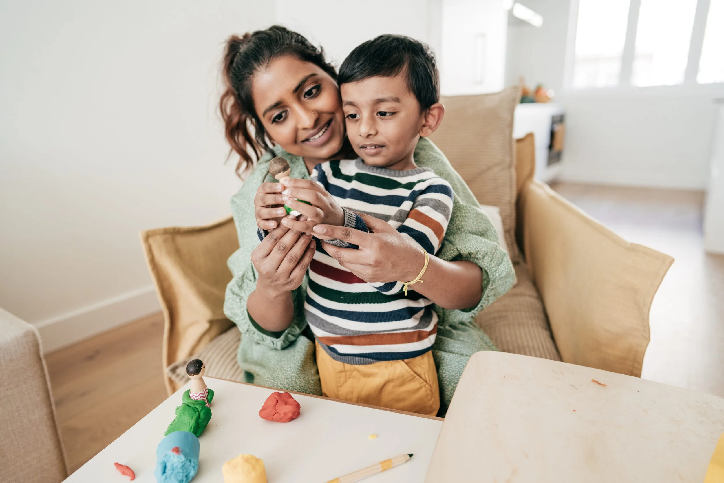 mom and son playing with play-doh during aba therapy