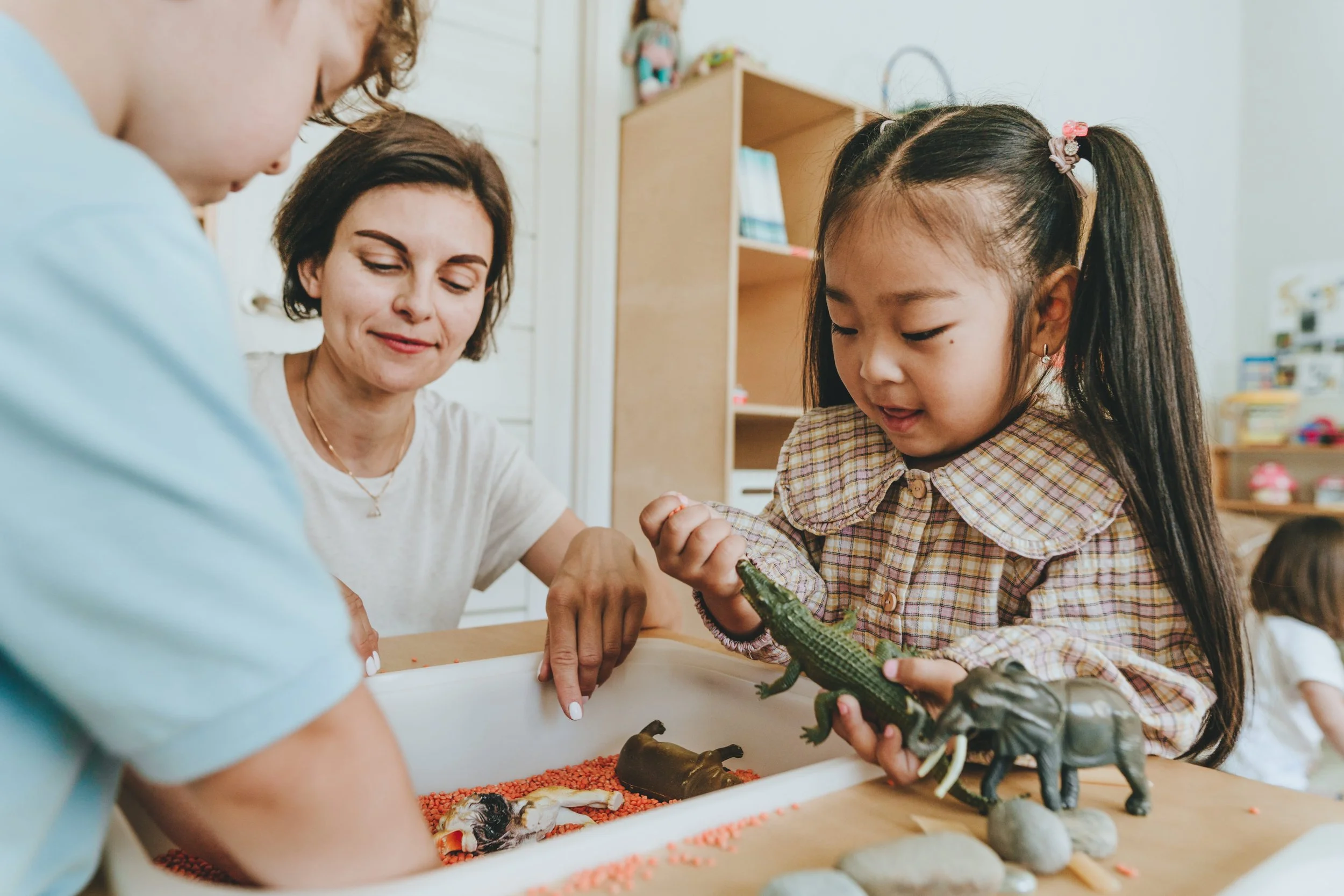 Teacher and group of children at daycare