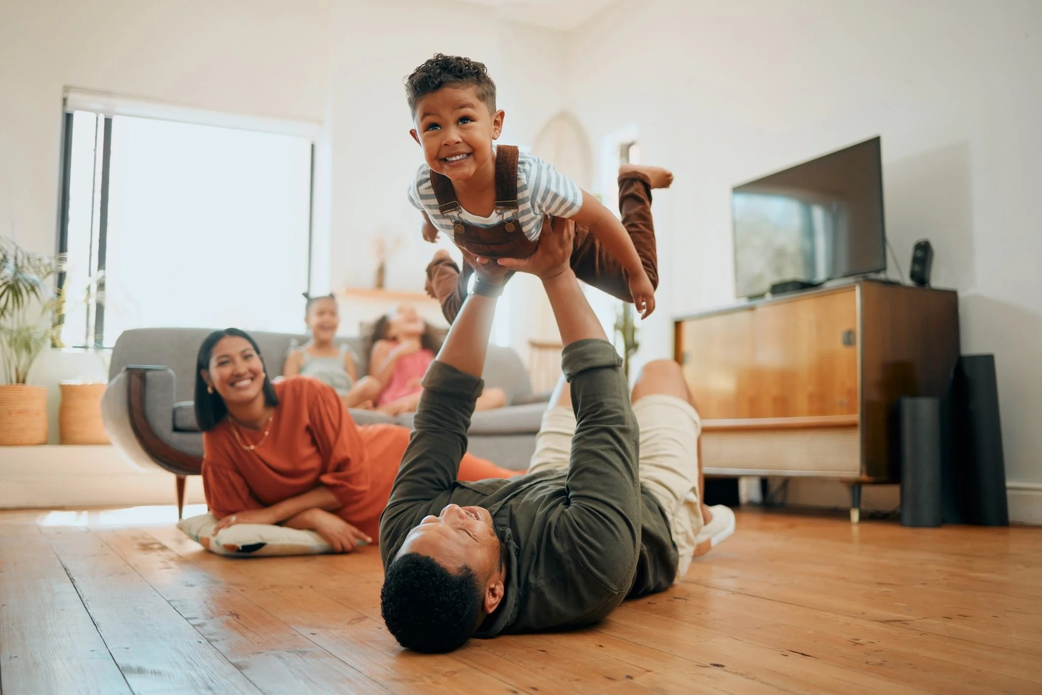 Family playing together in the living room