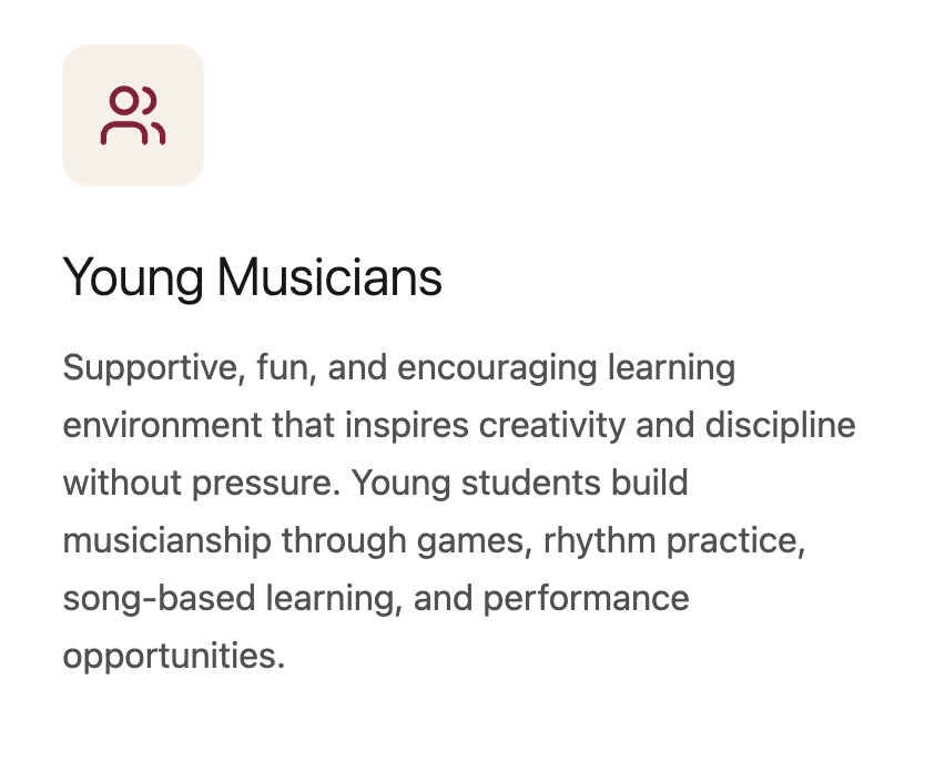 Young music student practicing guitar during lesson, supportive learning environment for beginner musicians.