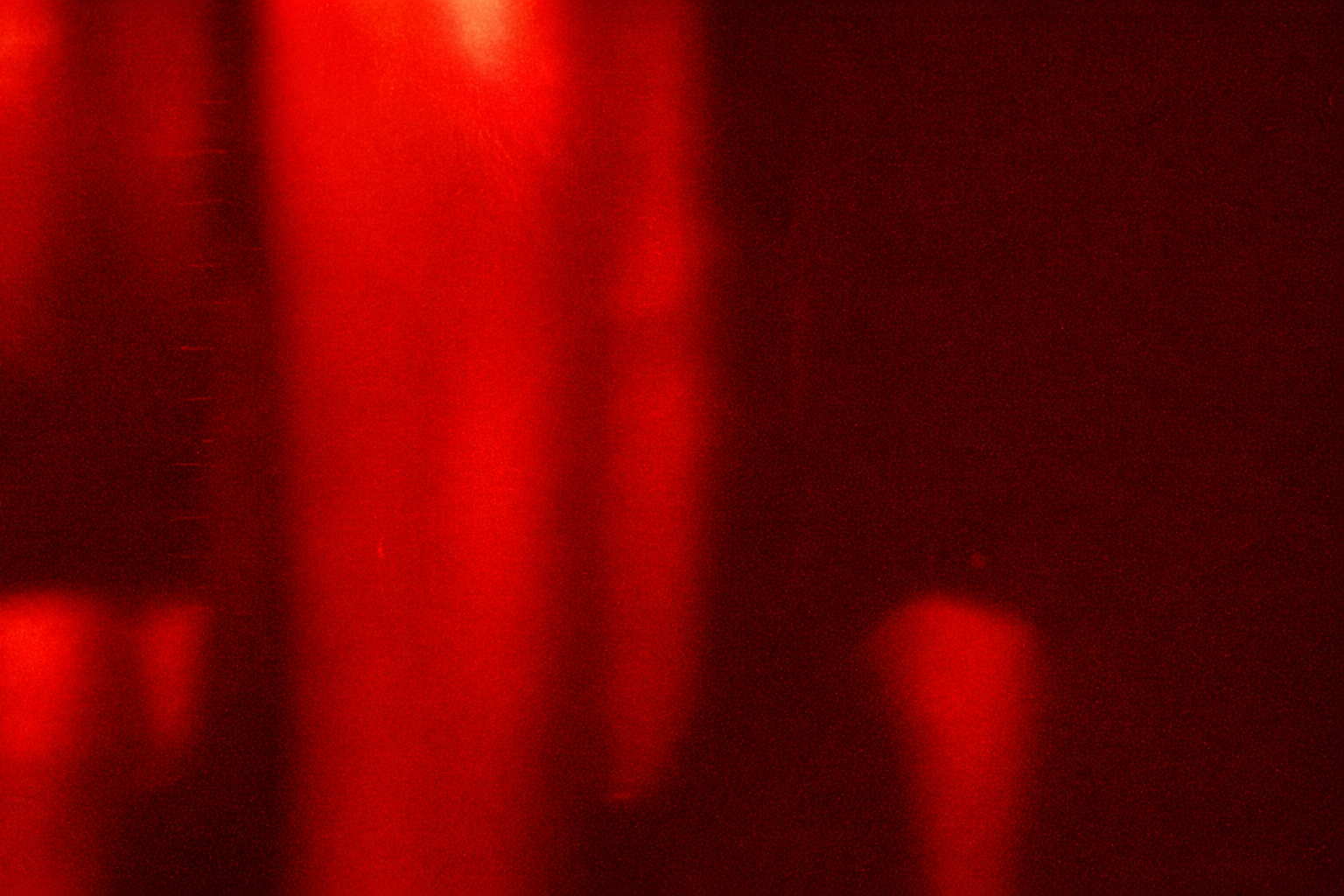 Dark background with vertical red light streaks