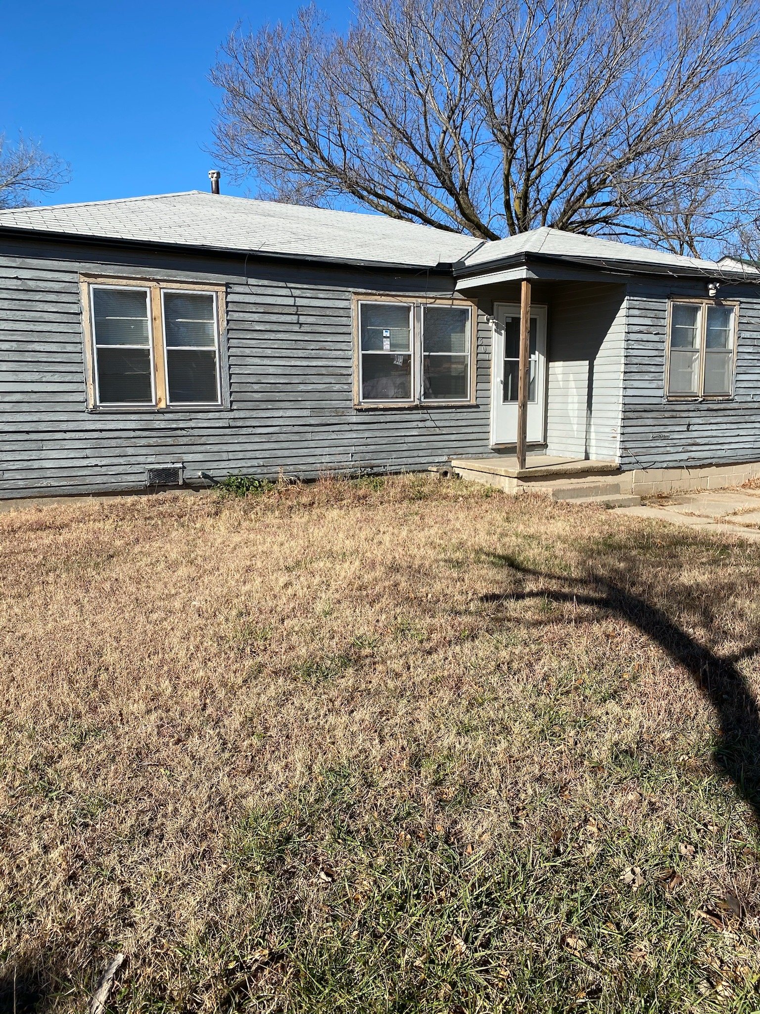 Oranssi technician working on a roof project