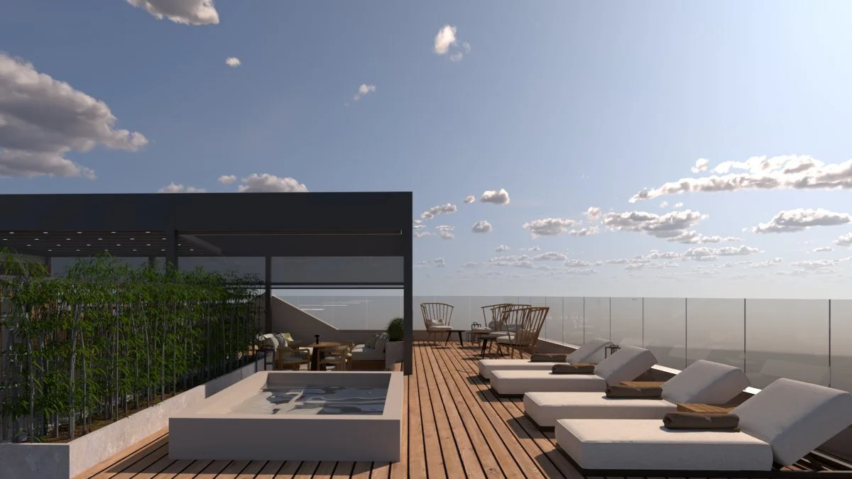 Rooftop terrace with lounge chairs, outdoor seating, and a hot tub, with a glass railing and a view of a partly cloudy sky.