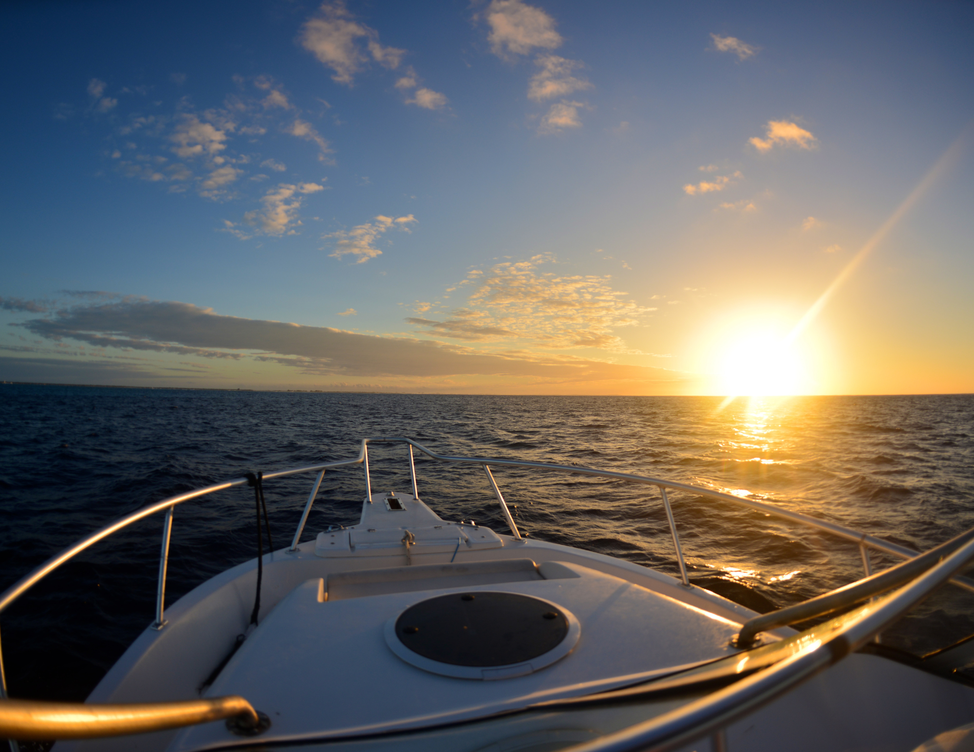 Sunset from a boat's bow on Lake Ontario Cape Vincent New York