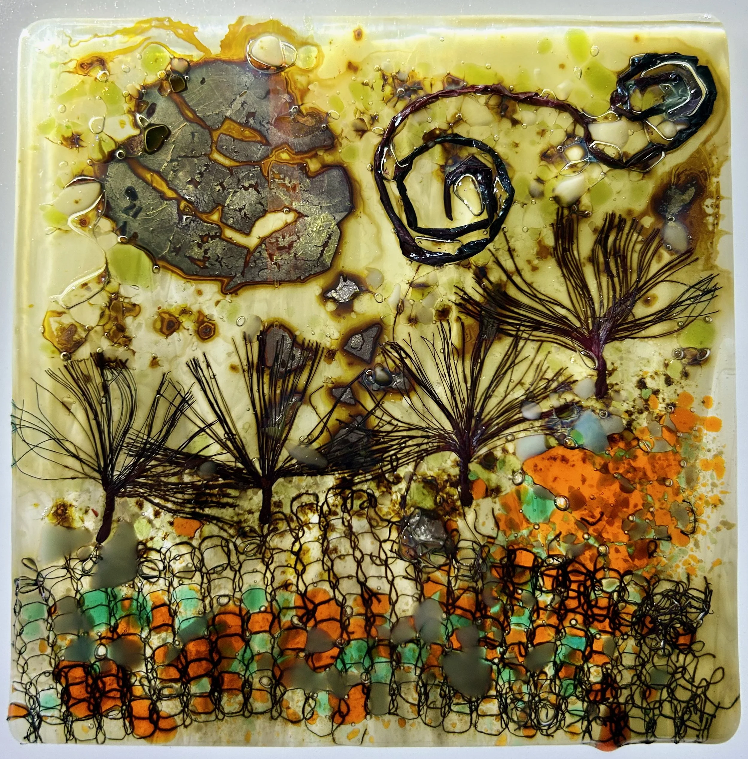 Decorative tile 16mm x 16mm
Coloured glass with glass frit & inclusions of silver leaf, copper foil, electric cable, copper wire & gold mica.
Inspired by a walk after Storm Arwen