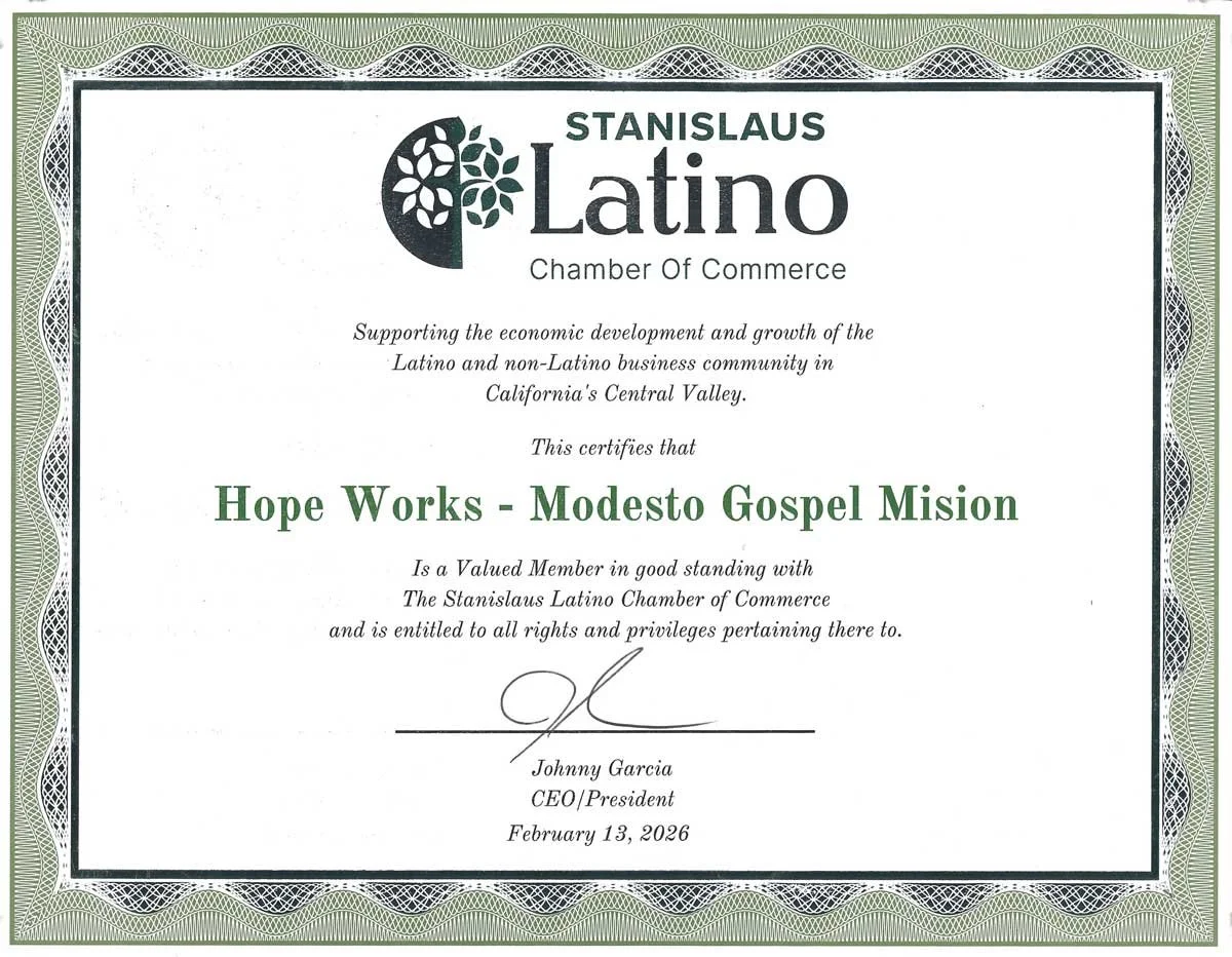 Certificate of recognition awarded to Hope Works - Modesto Gospel Mission by the Stanislaus Latino Chamber of Commerce, signed by Johnny Garcia, dated February 13, 2026.