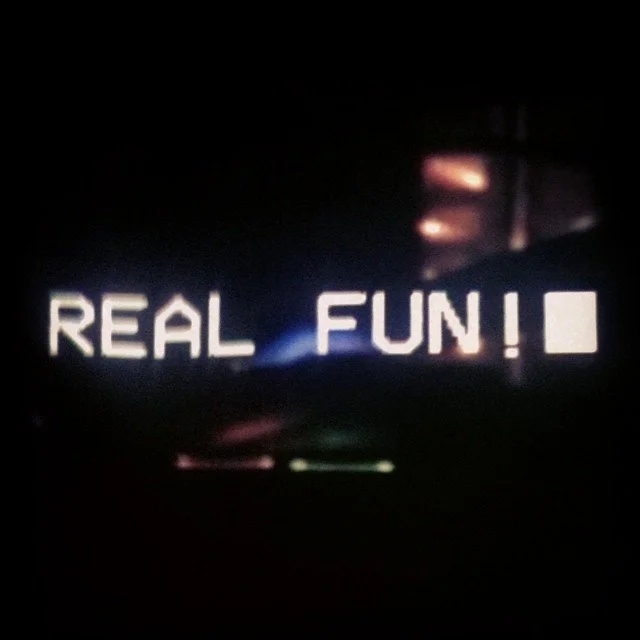 A dark screen displaying the text 'REAL FUN!' in white, pixelated font.