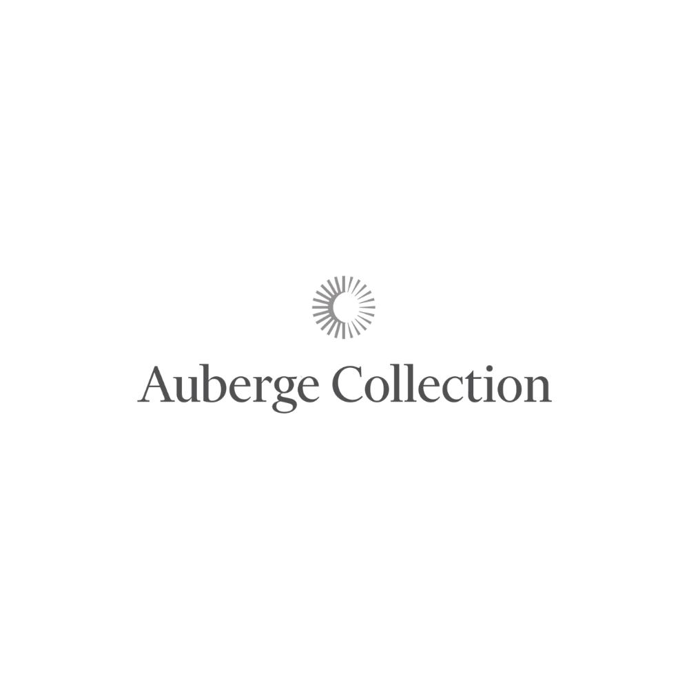 Black and white logo with a circular design and the text 'Auberge Collection' at the bottom.