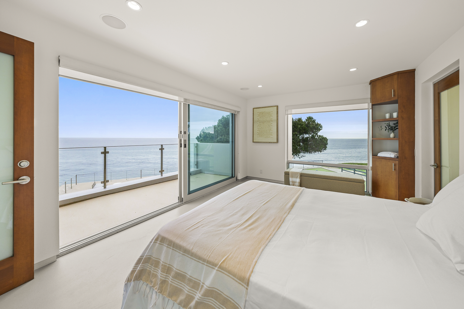 Shoreline House bedroom opening toward the ocean